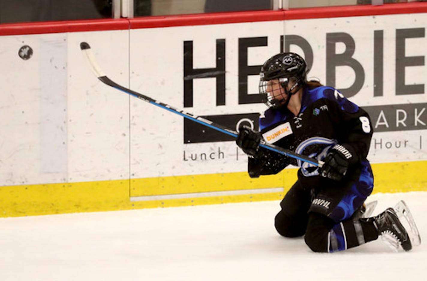 The Minnesota Whitecaps Amanda Boulier (8) shoots from her knees during the second period of the Whitecaps 5-1 win over the Metropolitan Riveters in the NWHL semifinals Friday, March 15, 2019, at TRIA Rink in St. Paul.