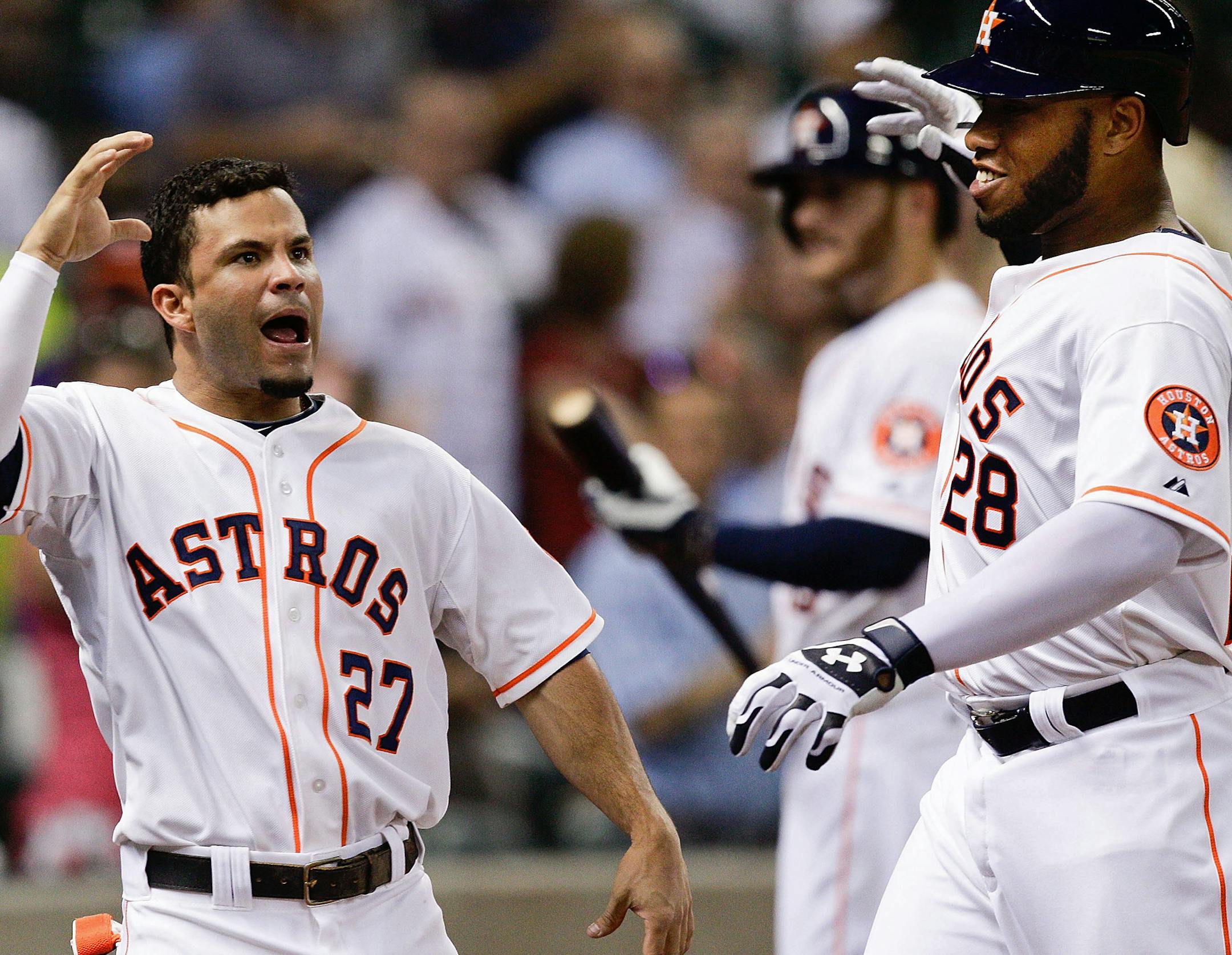 Houston Astros' Jon Singleton (28) is congratulated by Jose Altuve (27) after hitting a home run in the eighth inning against the Los Angeles Angels during a baseball game Tuesday, June 3, 2014, in Houston. (AP Photo/Bob Levey) ORG XMIT: MIN2014071420214227