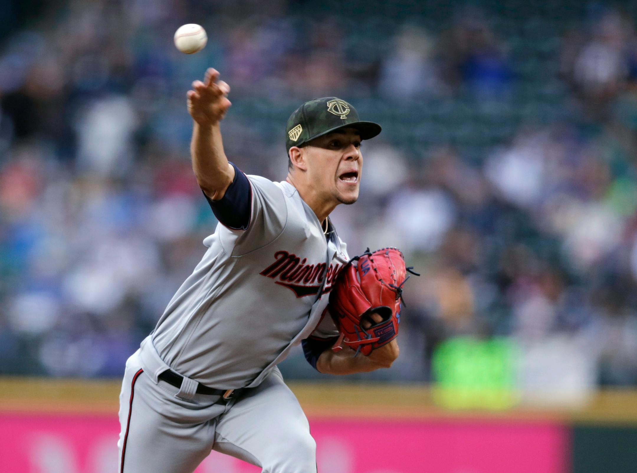 Minnesota Twins starting pitcher Jose Berrios works against the Seattle Mariners during the first inning of a baseball game Saturday, May 18, 2019, in Seattle. (AP Photo/John Froschauer)