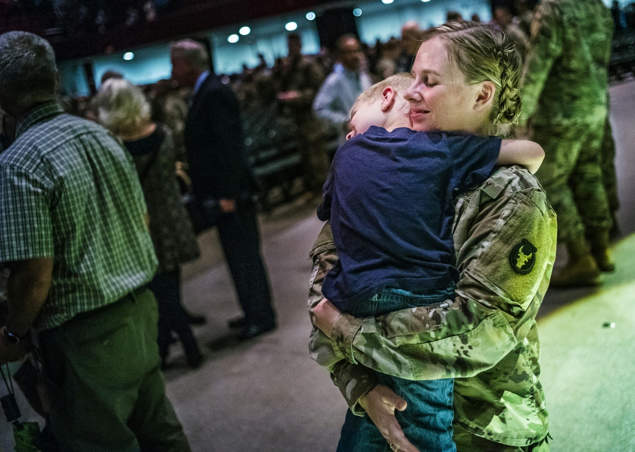 Stephanie Christoffels, a captain and a chaplain held on tight to son David,4 after the departure ceremony. She will be deployed for 10 months and has two other kids, Nicholas,6, and Emma,1.