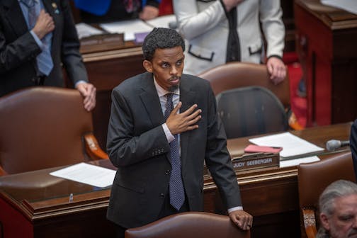 Member of the Minnesota Senate 62nd district Omar Mahmood Fateh stands for the Pledge Of Allegiance shortly before the morning’s Senate session at the Minnesota State Capitol in St. Paul on Mar. 20.