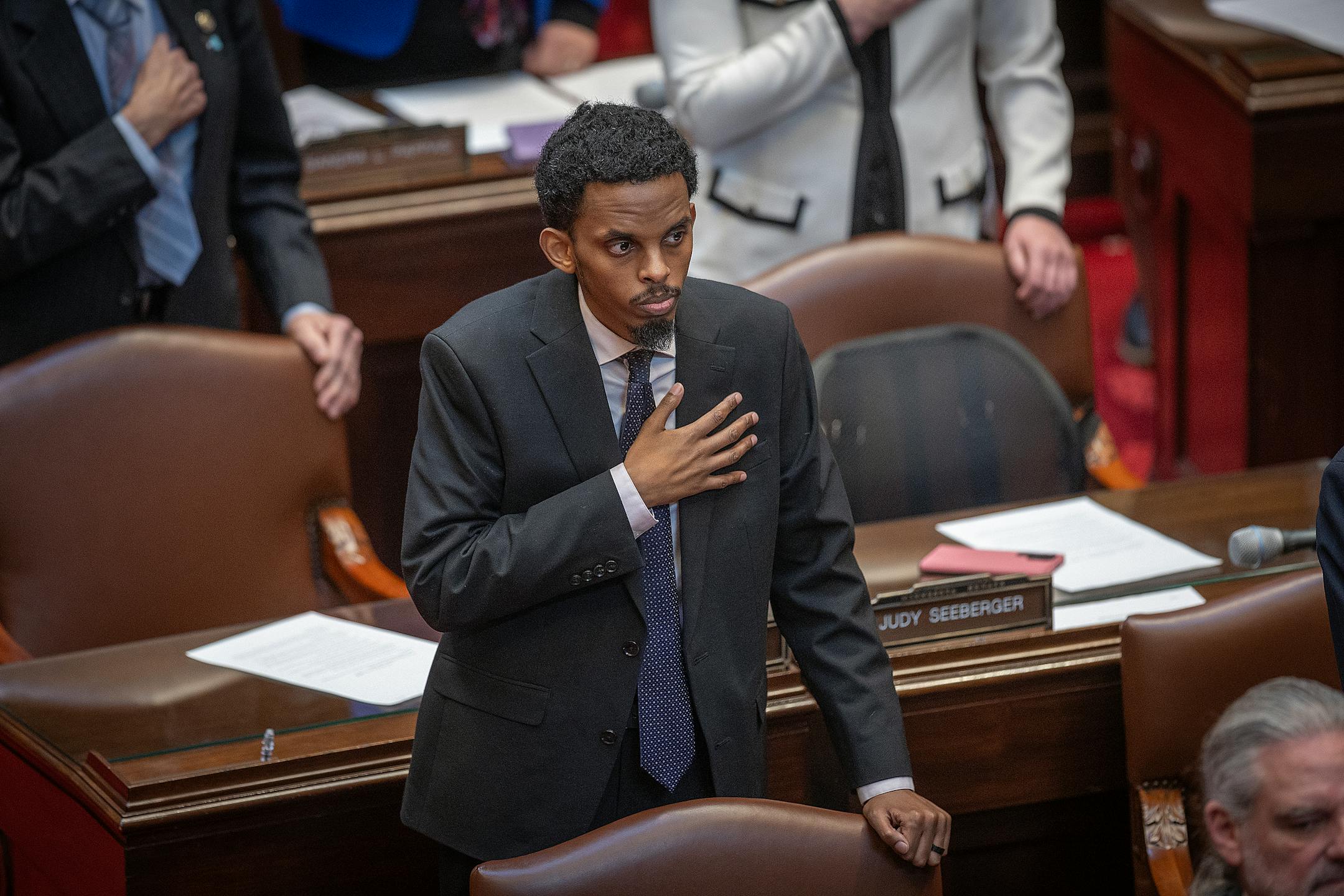 Member of the Minnesota Senate 62nd district Omar Mahmood Fateh stands for the Pledge Of Allegiance shortly before the morning’s Senate session at the Minnesota State Capitol in St. Paul on Mar. 20.