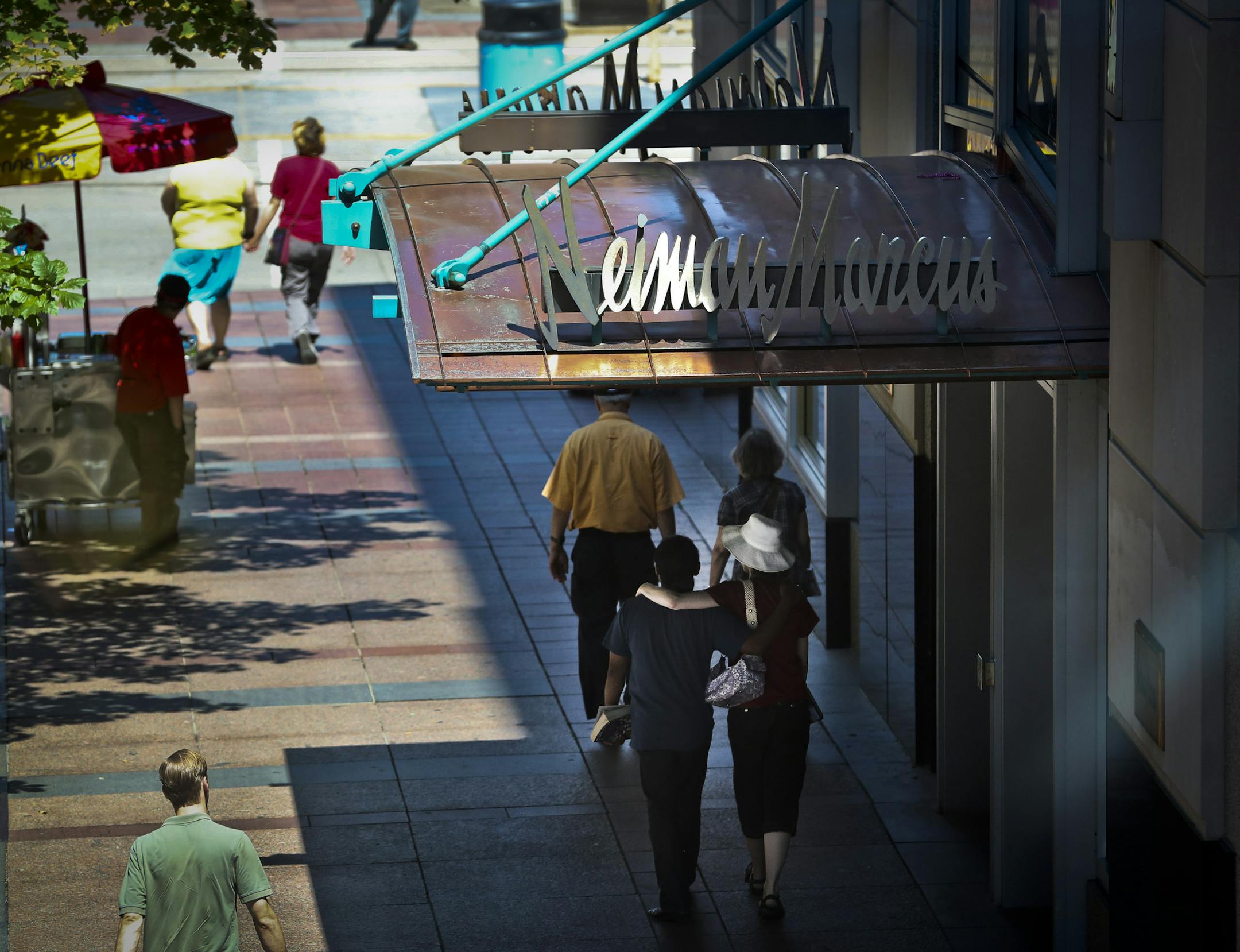 Neiman Marcus in downtown Minneapolis, Minn. is scheduled to close it's doors in July 2013. On Monday, July 23, 2012, people walked past the entrance of the downtown store. ] (RENEE JONES SCHNEIDER &#x2022; reneejones@startribune.com)