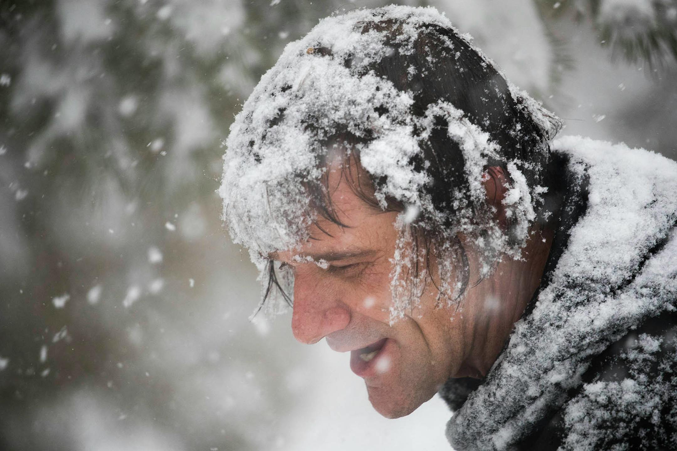 Chris Matiatos helps his neighbor shovel the sidewalk in St. Paul.