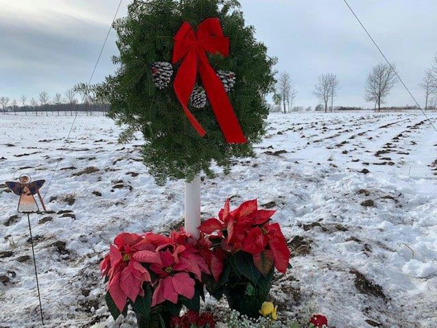 A wreath and flowers were among items left Saturday morning at the crash site of a Minnesota National Guard helicopter in Stearns County.