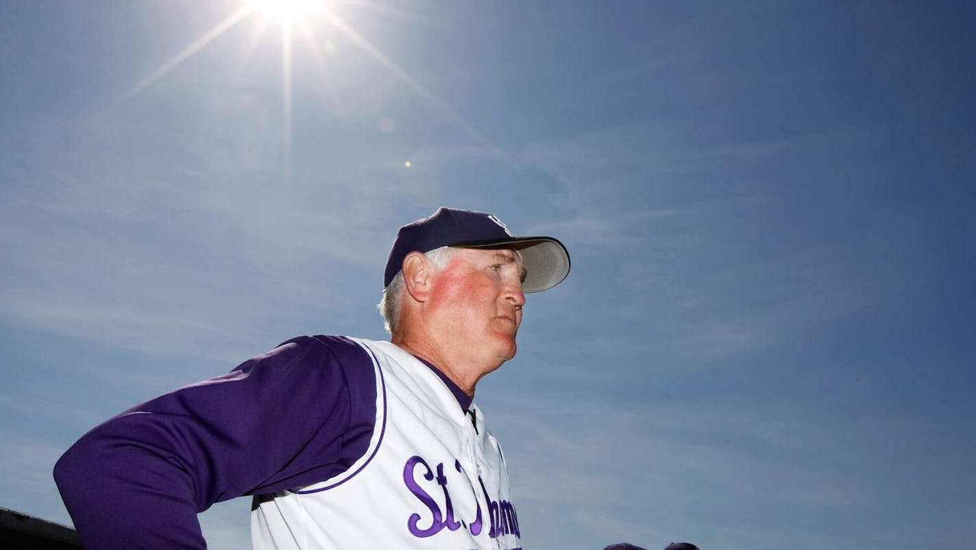 Head coach Dennis Denning keeps an eye on a baseball game against St. Olaf April 15, 2009 on Koch Diamond. The Tommies spit the double header 2-0 and 7-9. The first game represented head coach Dennis Denning's 500th victory.