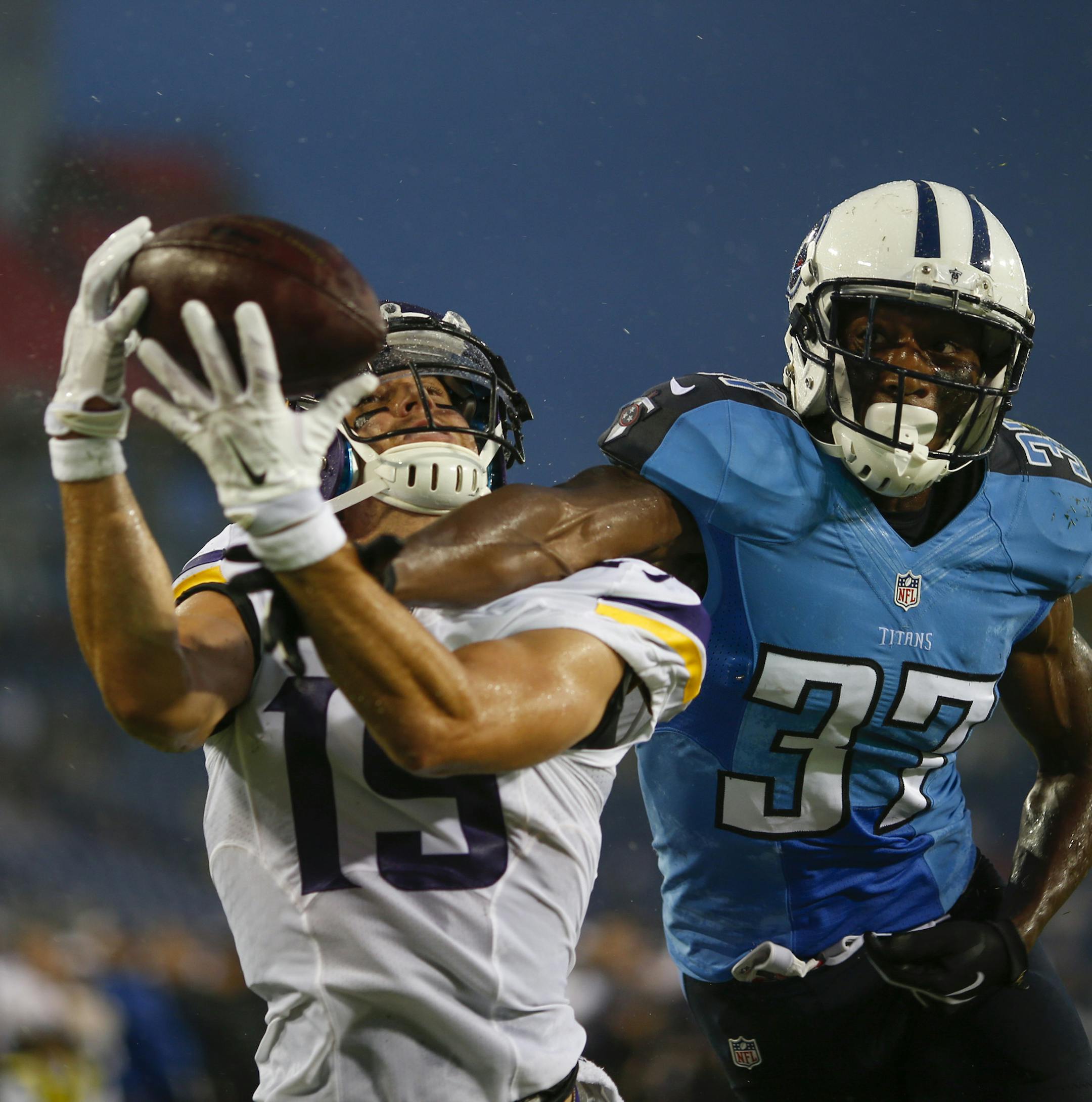 Vikings wide receiver Adam Thielen (19) hauled in a 3 yard touchdown pass despite coverage by Tennessee Titans defensive back Tommie Campbell (37) on the first Vikings possession Thursday night at LP Field in Nashville.
