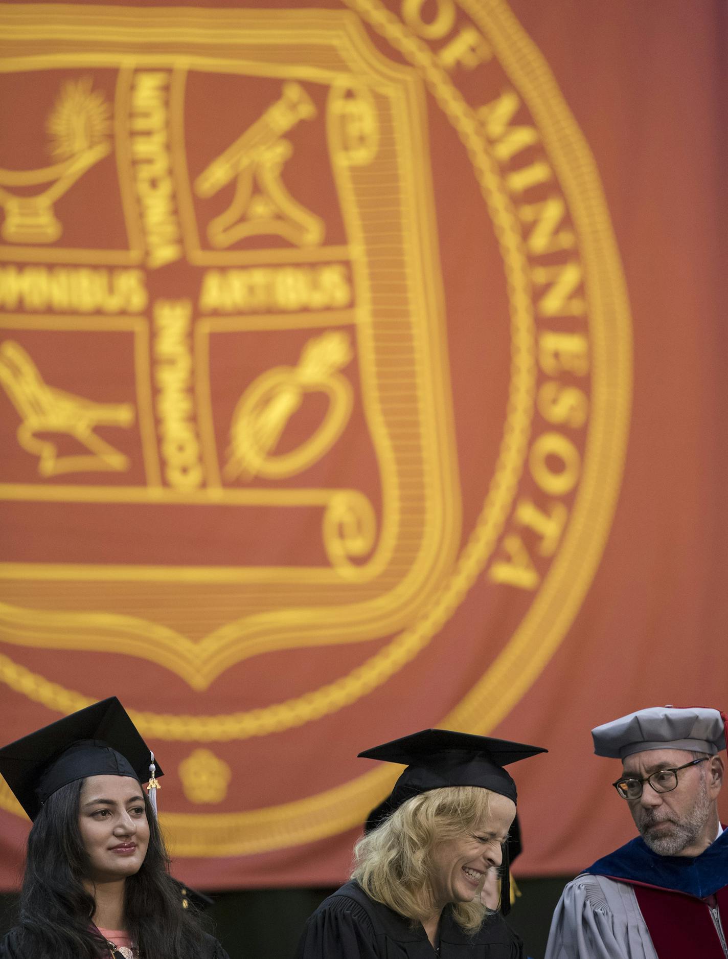 Maria Bamford (center keynote speaker), was flanked by Tejaswini Gupta left, who gave the students remarks , and John Coleman Dean, during the 2017 College of Liberal Arts graduation at Mariucci Arena Sunday May 14, 2017 in Minneapolis, MN. ] JERRY HOLT &#xef; jerry.holt@startribune.com