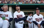Minnesota Twins manager Rocco Baldelli (5) and Minnesota Twins bench coach Derek Shelton (9) joked with each other before Saturday's game. ] ANTHONY S