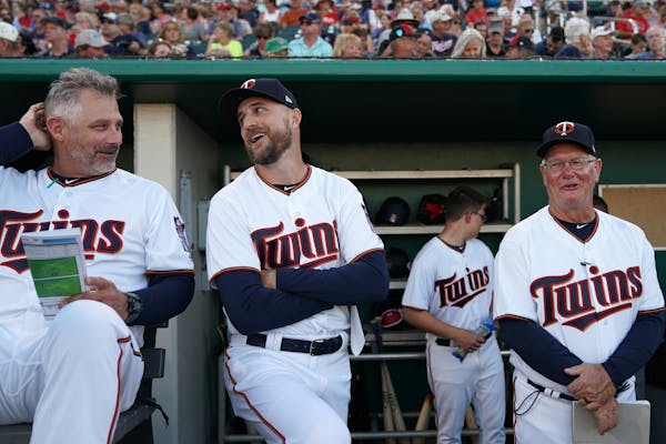 Minnesota Twins manager Rocco Baldelli (5) and Minnesota Twins bench coach Derek Shelton (9) joked with each other before Saturday's game. ] ANTHONY S