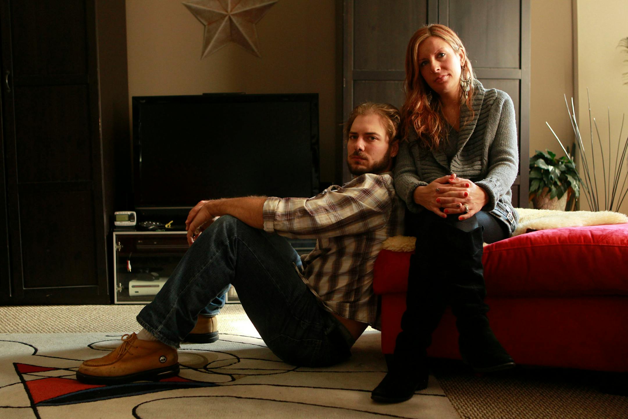 Ian and Jessica Riley both owe money on their student loans five years after graduation. They are shown at their home in Chicago, Illinois, on October 27, 2011.