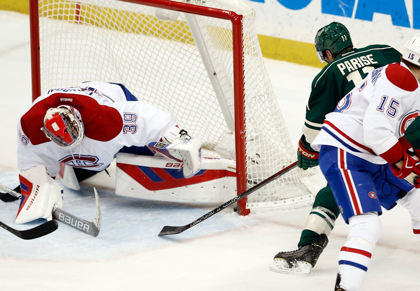 The puck sits across the goal line on a shot by theWild�s Zach Parise, right, against Montreal goalie Mike Condon in the third period Tuesday. A review determined it wasn't a goal.