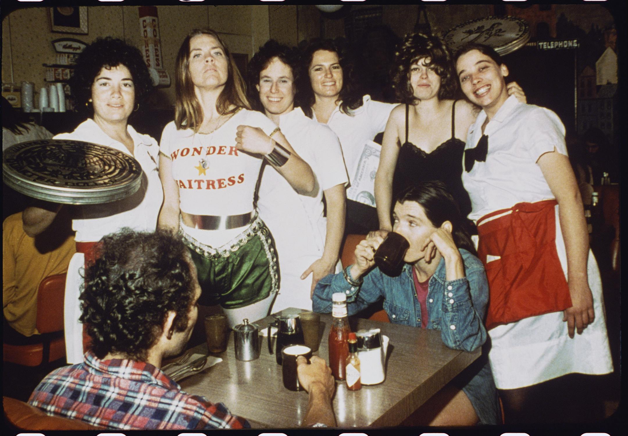 "Wonder Waitress" by the Waitress, a collaborativbe performance art group. WonderWomen exhibit. Provided by Katherine E. Nash Gallery.