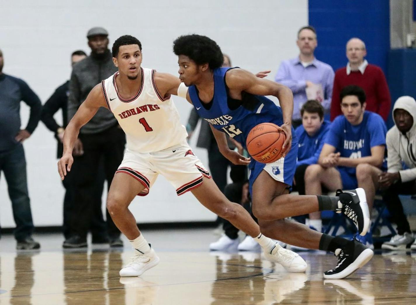 Hopkins star Kerwin Walton (right) dribbled against Minnehaha Academy's Jalen Suggs this season. Walton is going to North Carolina; Suggs to Gonzaga.