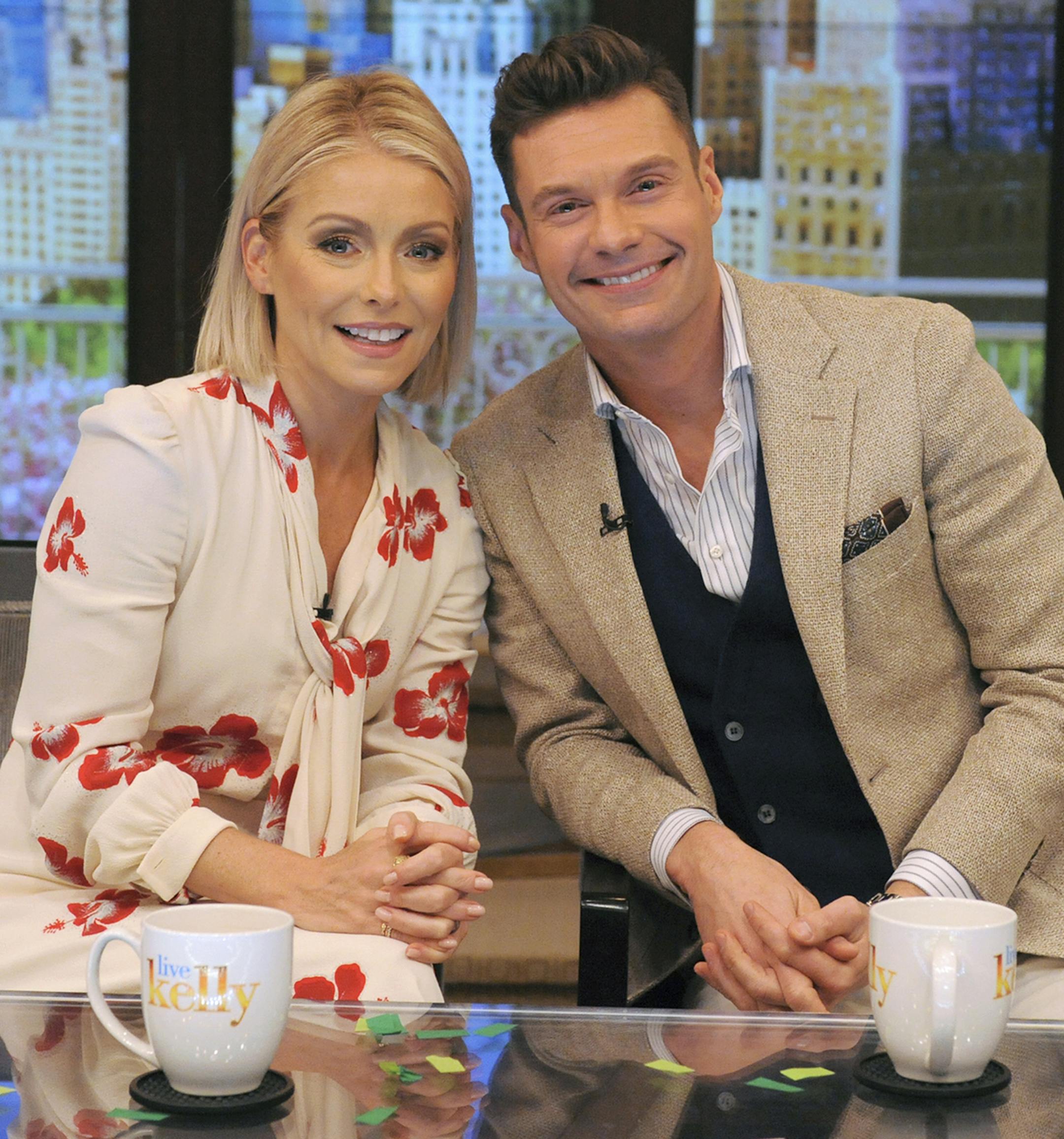 In this photo released by Disney/ABC Home Entertainment and TV Distribution, Kelly Ripa and Ryan Seacrest pose for a photo at "Live" on Monday, May 1, 2017, in New York. Seacrest was named co-host of the morning chat show, ending a yearlong search for a marquee name as Michael Strahan's successor. (Pawel Kaminski/Disney/ABC Home Entertainment and TV Distribution via AP)