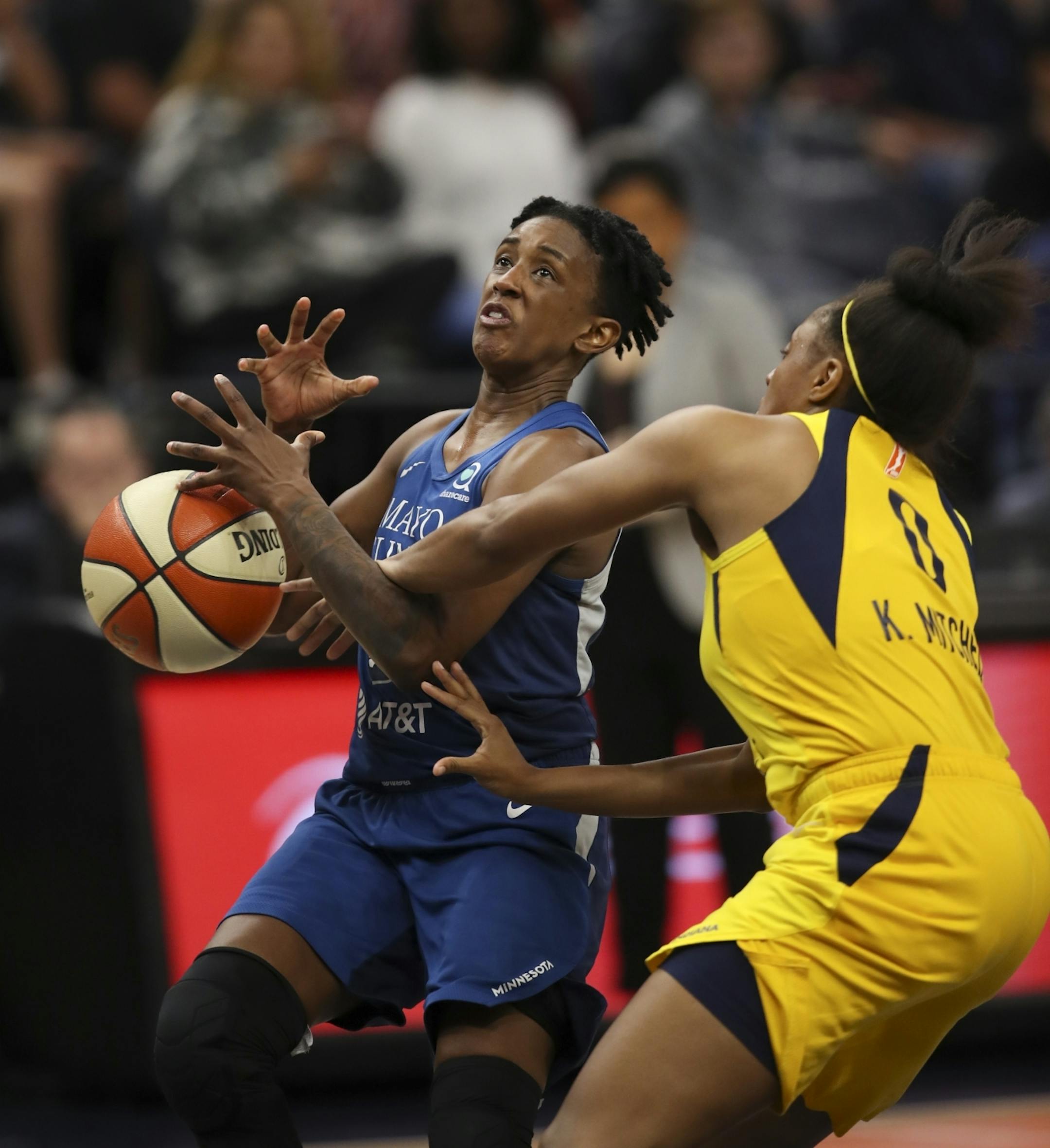 Indiana Fever guard Kelsey Mitchell (0) stripped the ball from Minnesota Lynx guard Danielle Robinson (3) when she had a fast break in the fourth quarter.