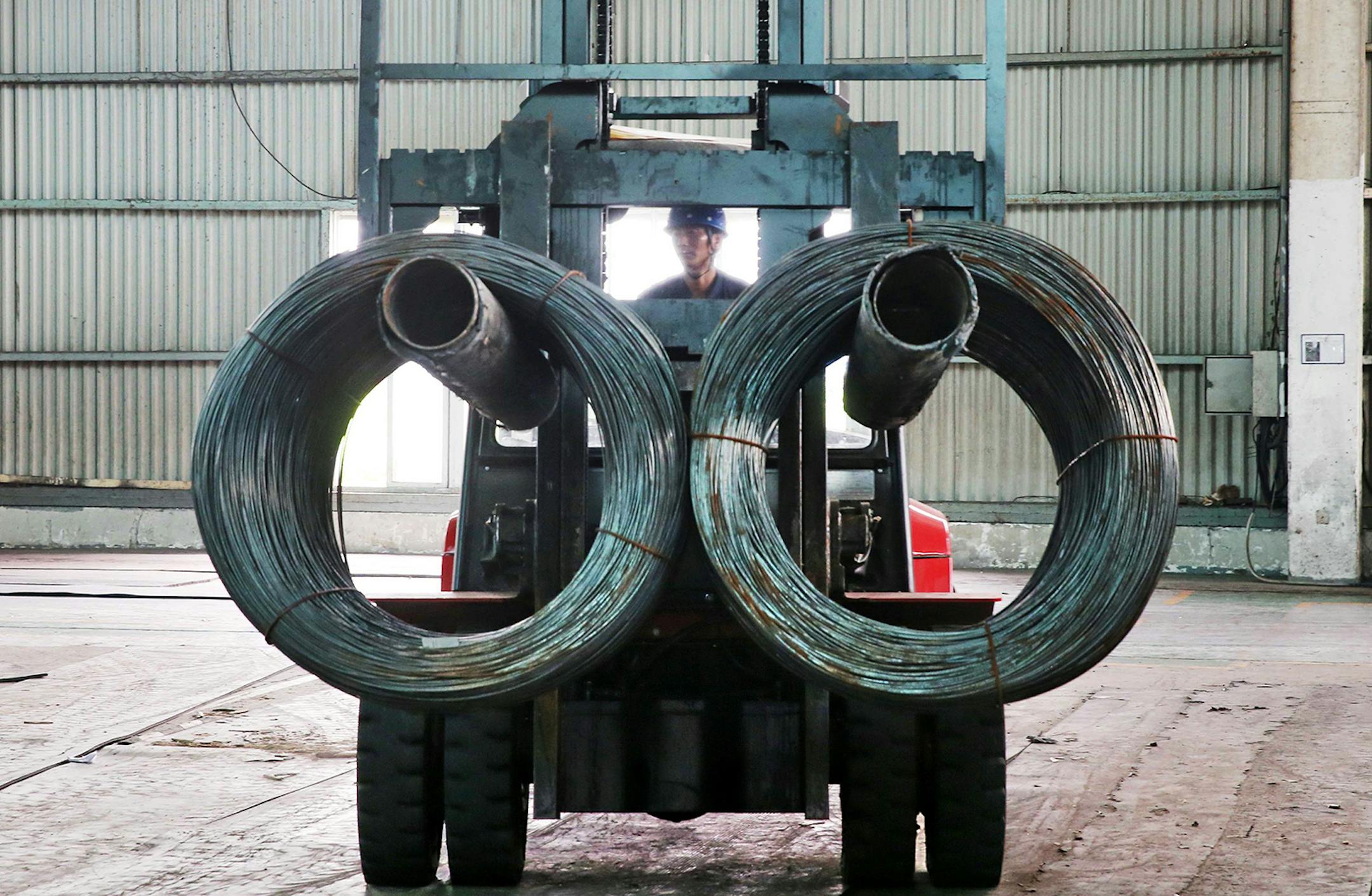This photo taken on July 3, 2018 shows a worker transferring steel cables at a steel factory in Nantong in China's eastern Jiangsu province. (Ryan McMorrow/AFP/Getty Images/TNS) ORG XMIT: 1533522
