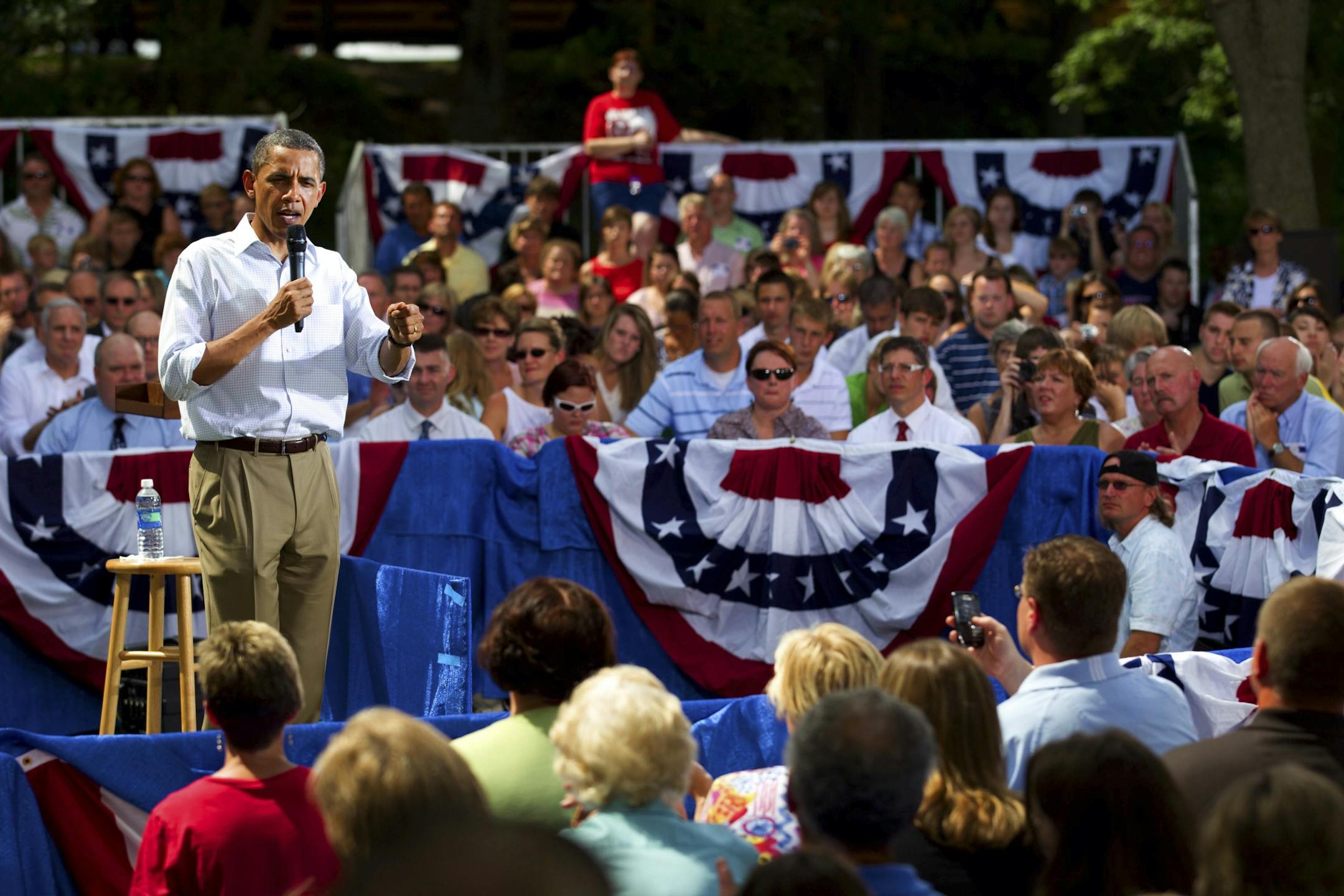 President Barack Obama speaks at a town hall meeting at Lower Hannah's Bend Park in Cannon Falls, Minn., on Aug. 15, 2011. Obama, beset by convulsing financial markets, a relapsing economy and corrosive political discord in Washington, left Washington on Monday for a three-day bus tour of the Midwest designed to underscore his resolve to lift the nation out of its morass.
