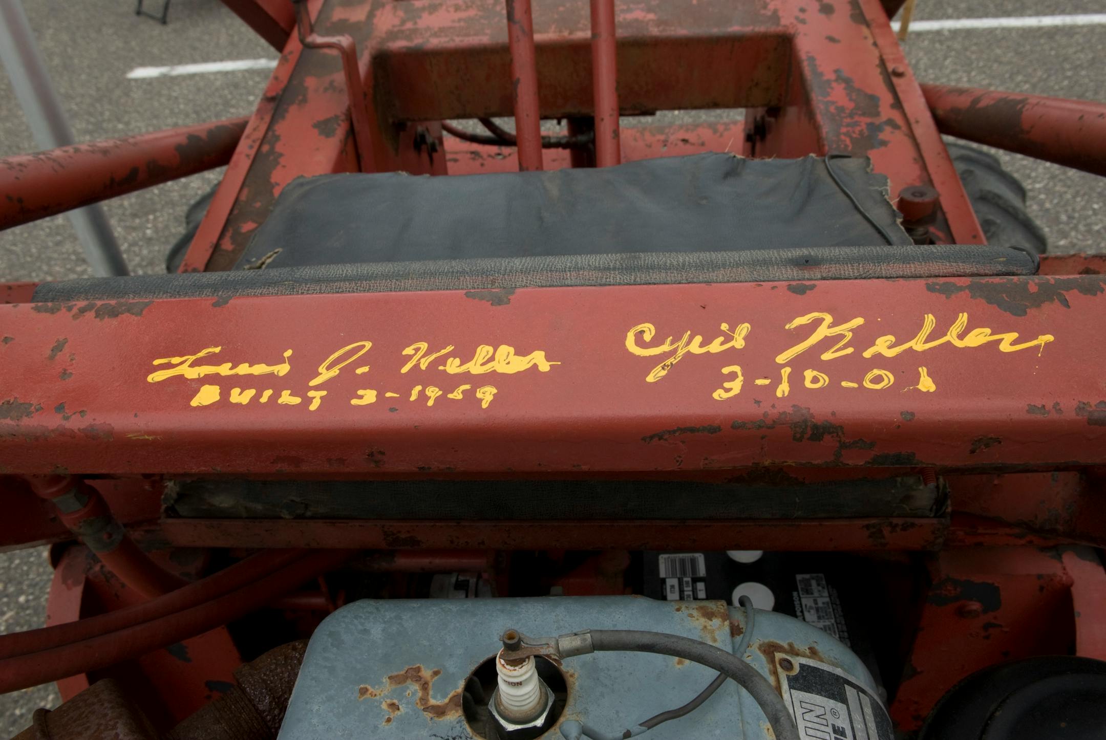 The Kellers autographed this early skid-steer loader after one of their sons found it.