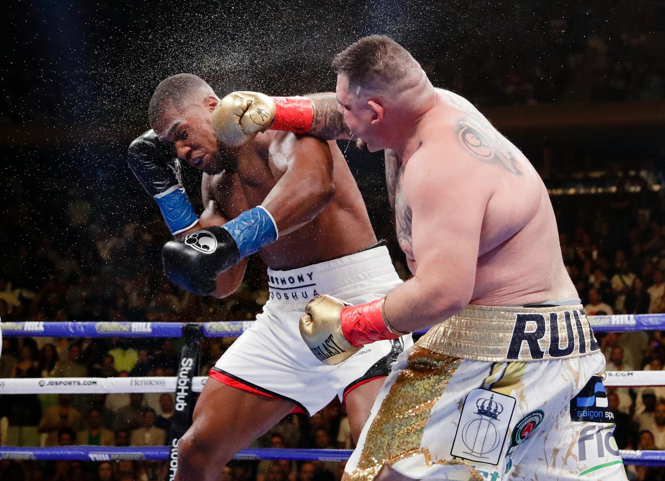 Andy Ruiz, right, punches Anthony Joshua during the seventh round of a heavyweight championship boxing match Saturday