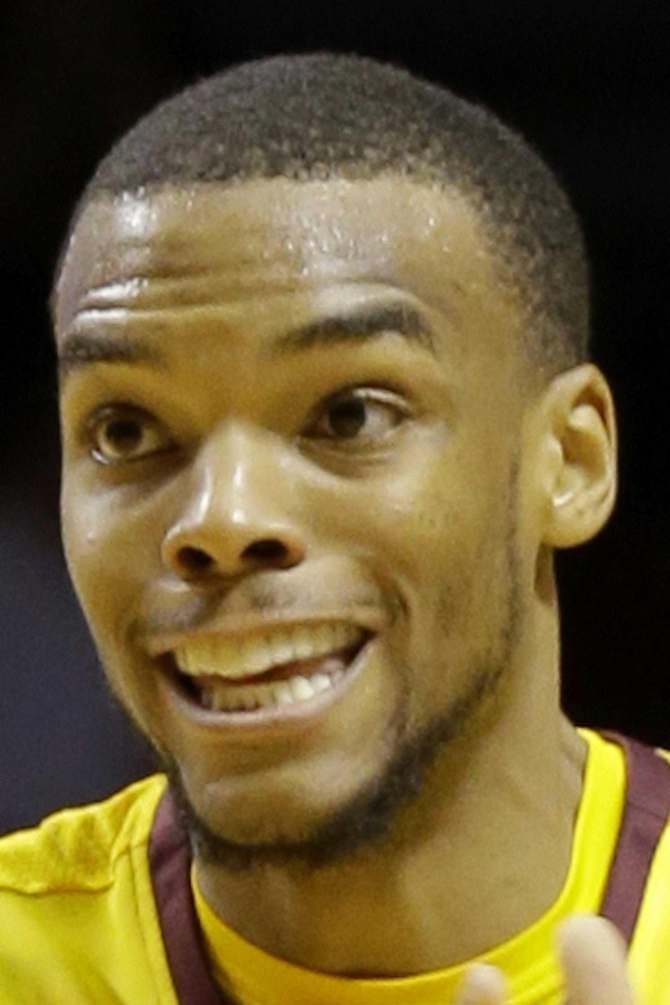 Minnesota guard Andre Hollins looks to pass to a teammate during the second half of an NCAA college basketball game against Nebraska-Omaha in Minneapolis, Friday, Dec. 20, 2013. Minnesota won 92-79. (AP Photo/Ann Heisenfelt)