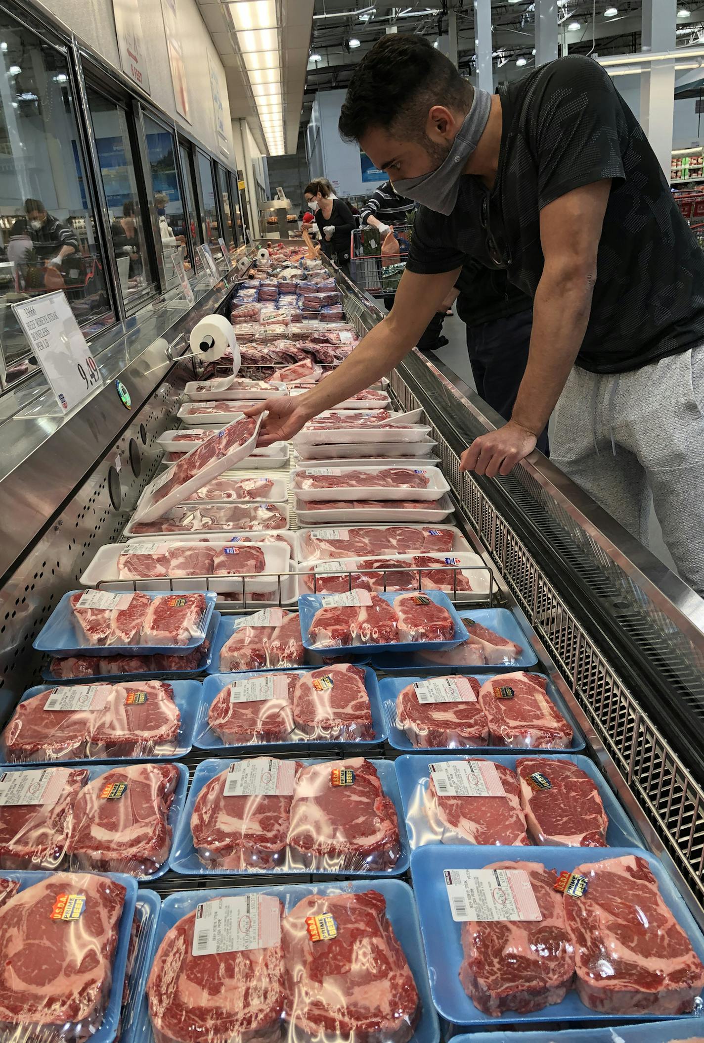 With possible shortages looming, the meat department was busy at the St. Louis Park Costco. Meat purchases were limited to 3 packages. Today marks the first day that Costco is requiring its members to wear a mask while shopping its its stores.] RICHARD TSONG-TAATARII &#xa5; richard.tsong-taatarii@startribune.com