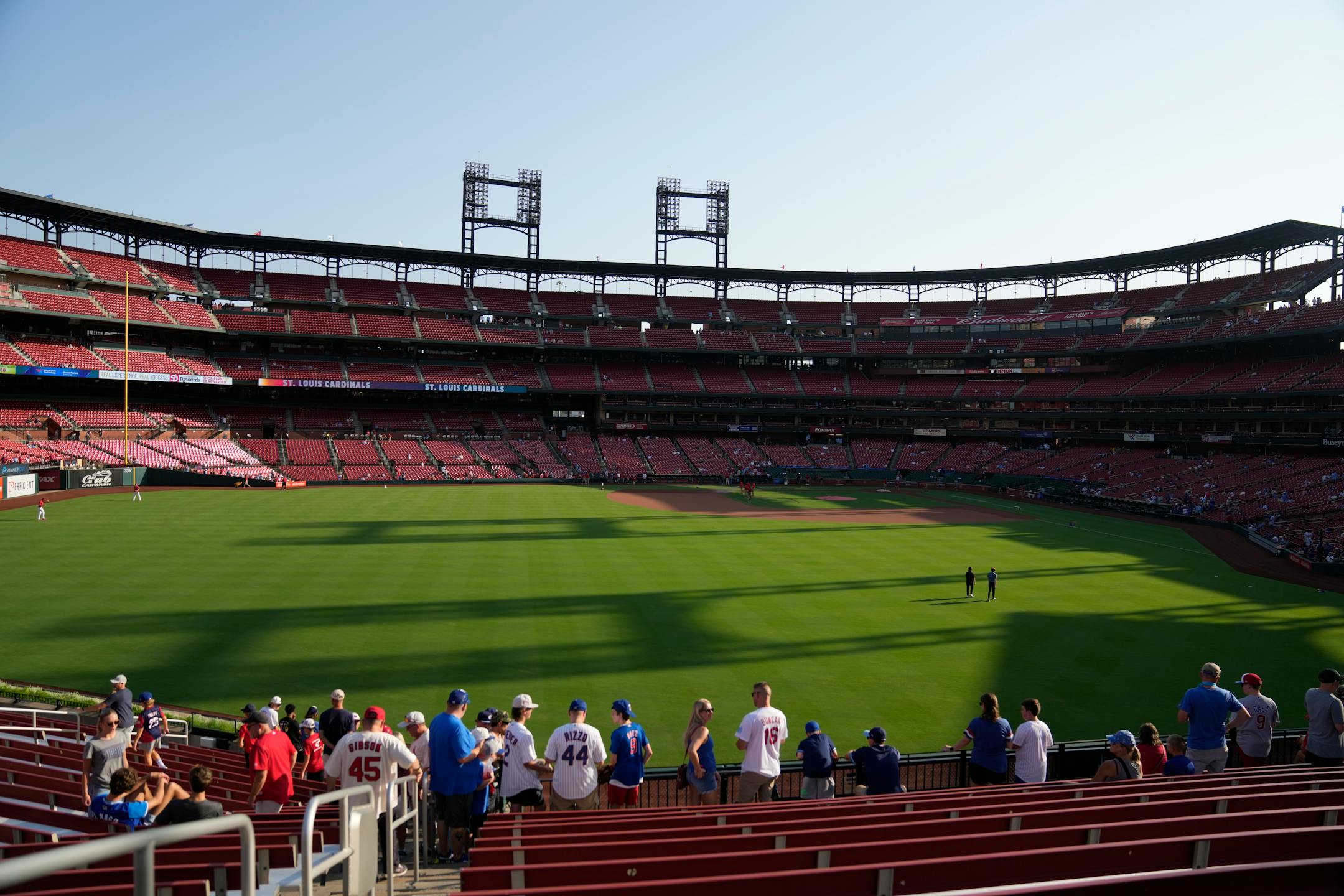 Fans stand in the bleachers in Busch Stadium before the start of a baseball game between the St. Louis Cardinals and the Chicago Cubs Friday, July 28, 2023, in St. Louis. (AP Photo/Jeff Roberson)