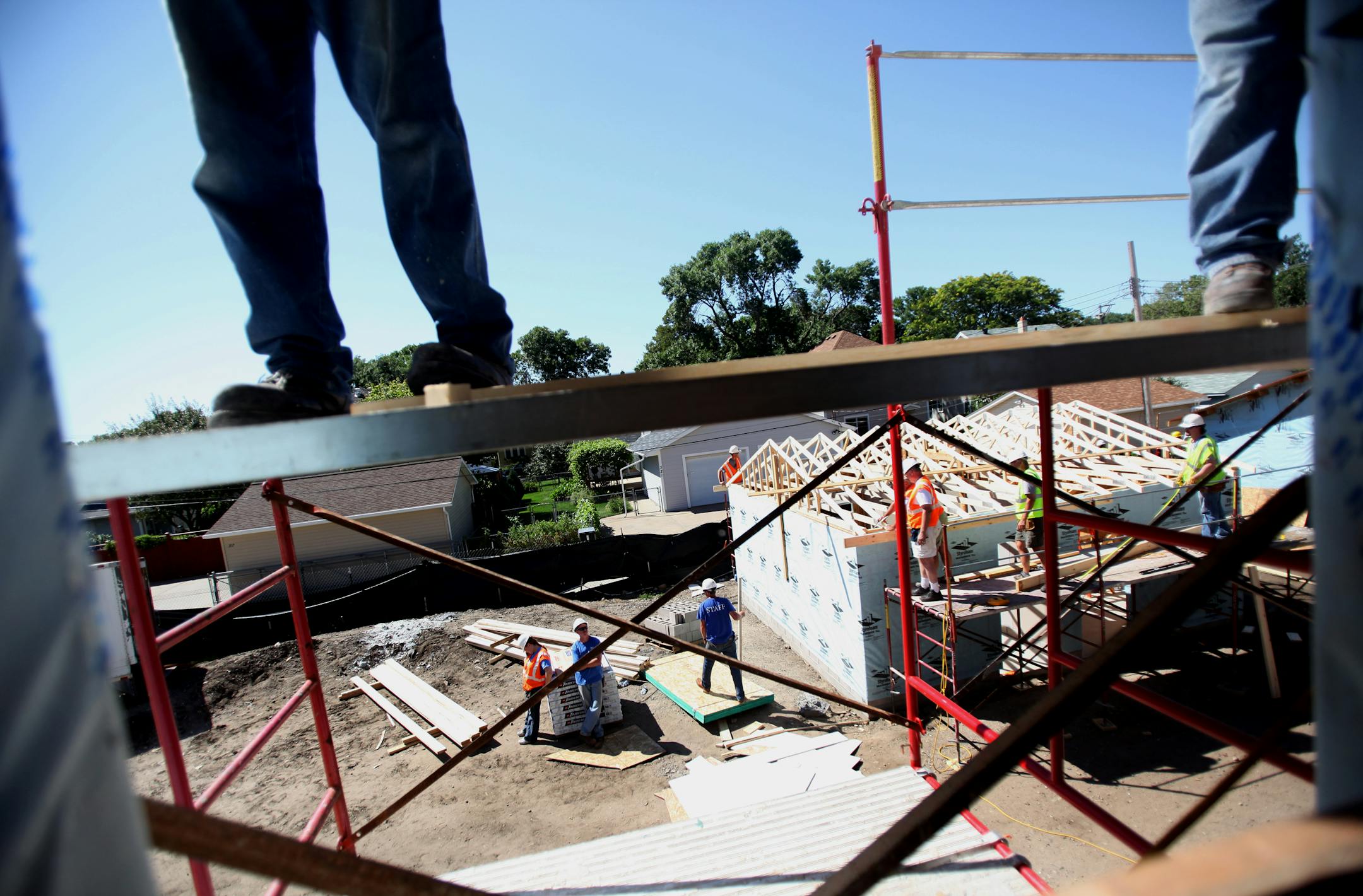 Volunteers worked Wednesday on an eight-unit townhouse development being built by Habitat for Humanity in Minneapolis.
