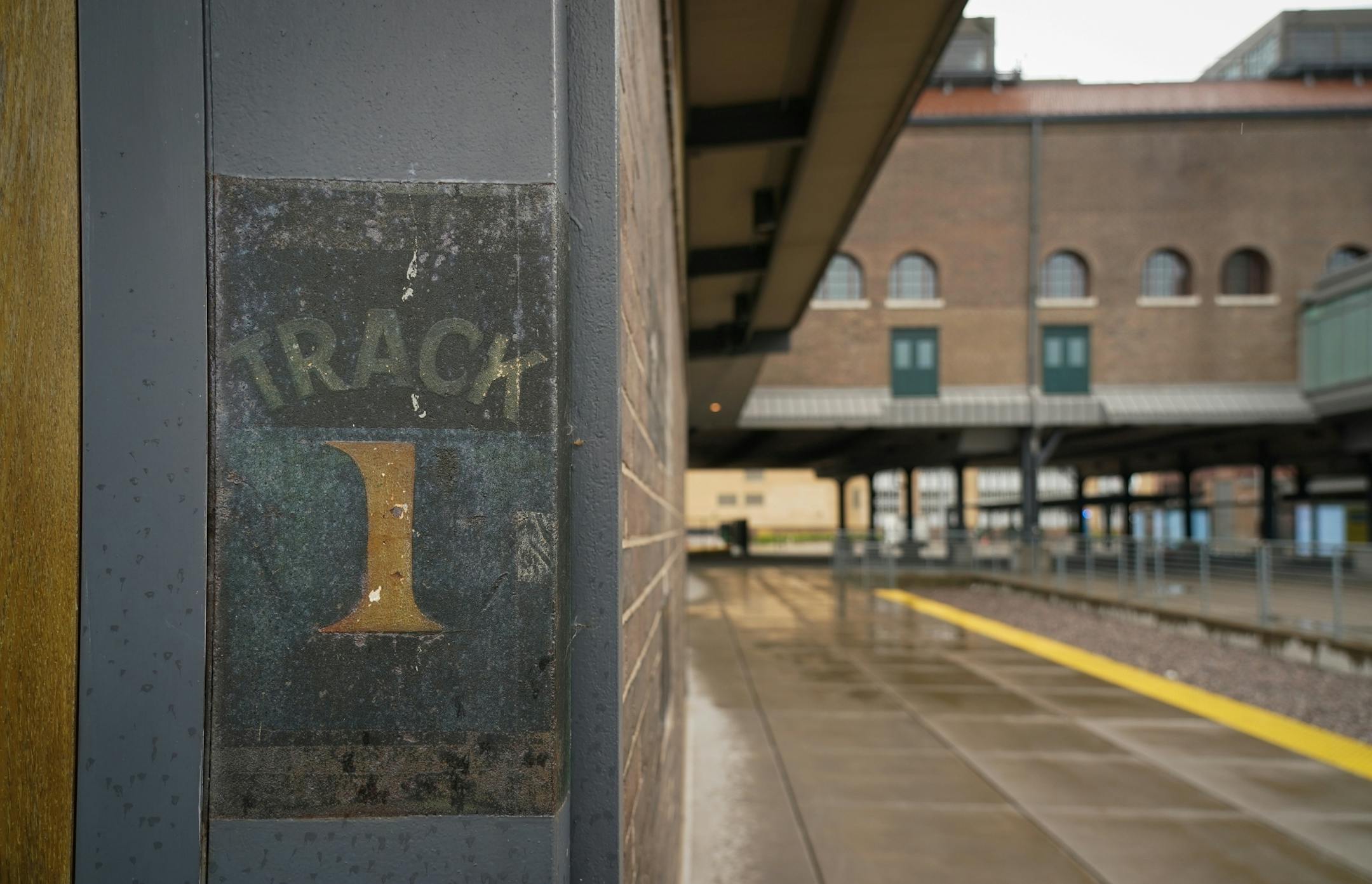 Original signage remains at the end of a stairway to Union Depot Gate B.