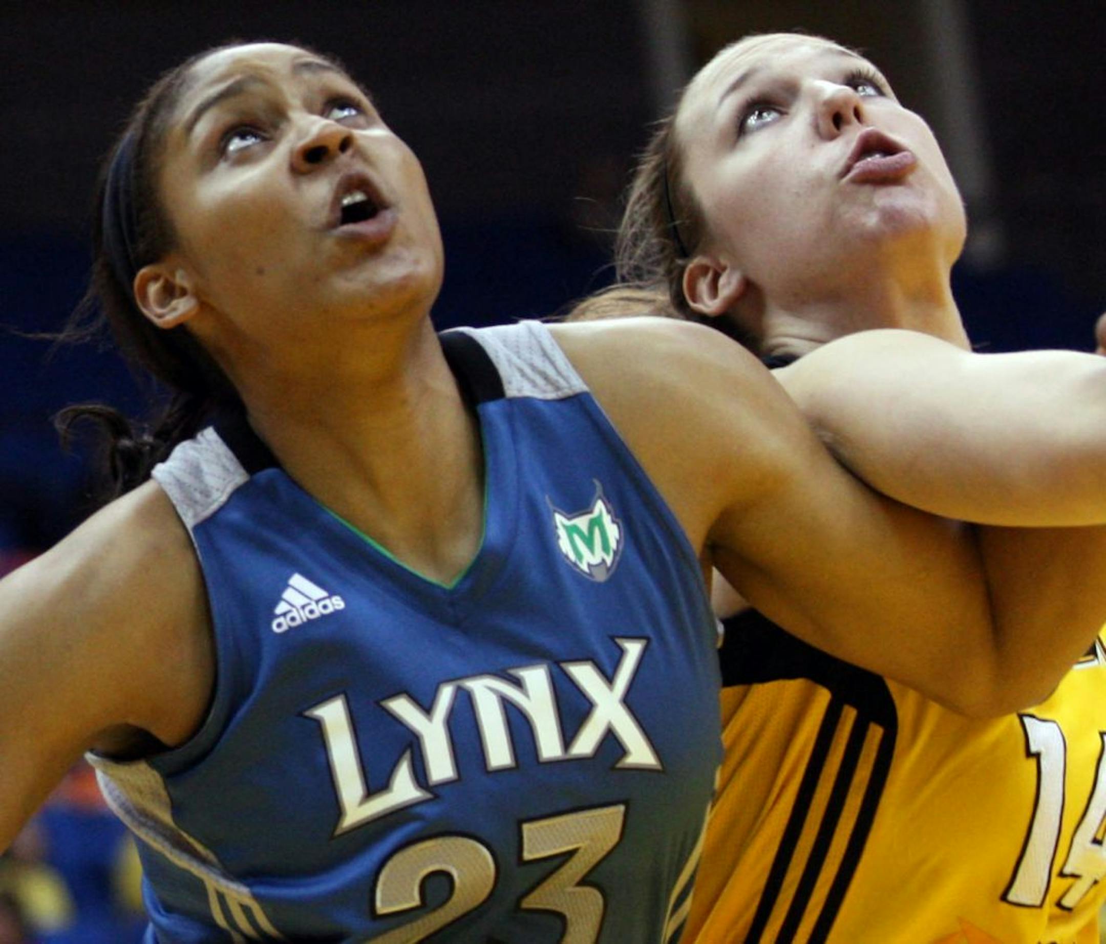 Tulsa Shock's Kayla Pedersen, right, and Minnesota Lynx's Maya Moore look for a rebound during a WNBA basketball game Tuesday, July 10, 2012, in Tulsa, Okla. (AP Photo/Tulsa World, Cory Young) ONLINES OUT TV OUT TULSA OUT