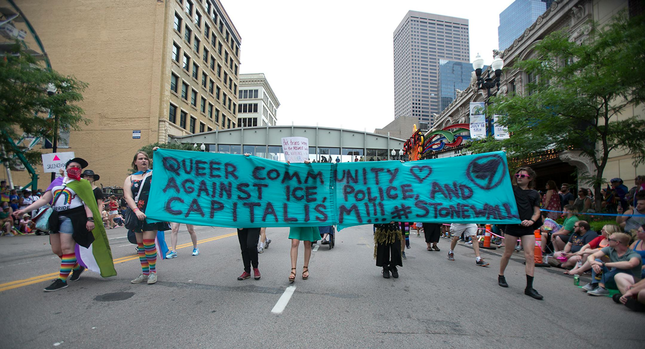 Protestors marched ahead of the pride parade on Sunday to call attention to misconduct by police and the death of black community members.