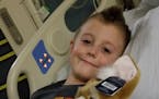 Quinton Hill, 7, lost movement in one arm last month due to a mysterious syndrome known as acute flaccid myelitis. Treatment at Children's Hospital fo
