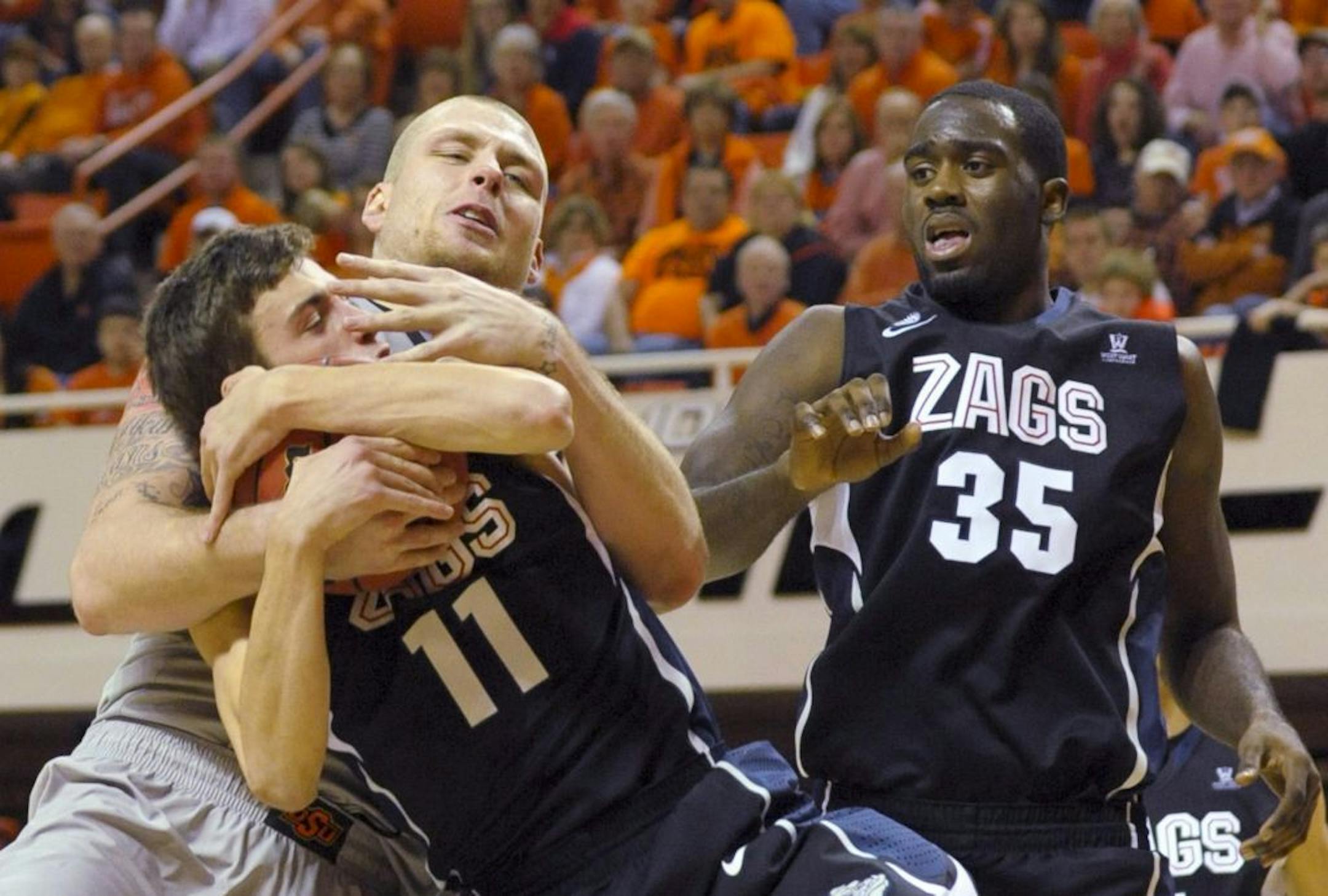 Gonzaga center Sam Dower, right,
