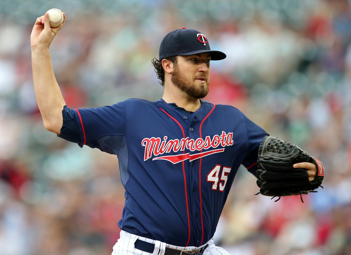 Minnesota Twins pitcher Phil Hughes throws against the Cleveland Indians in the first inning of a baseball game, Thursday, Aug. 21, 2014, in Minneapolis. (AP Photo/Jim Mone)