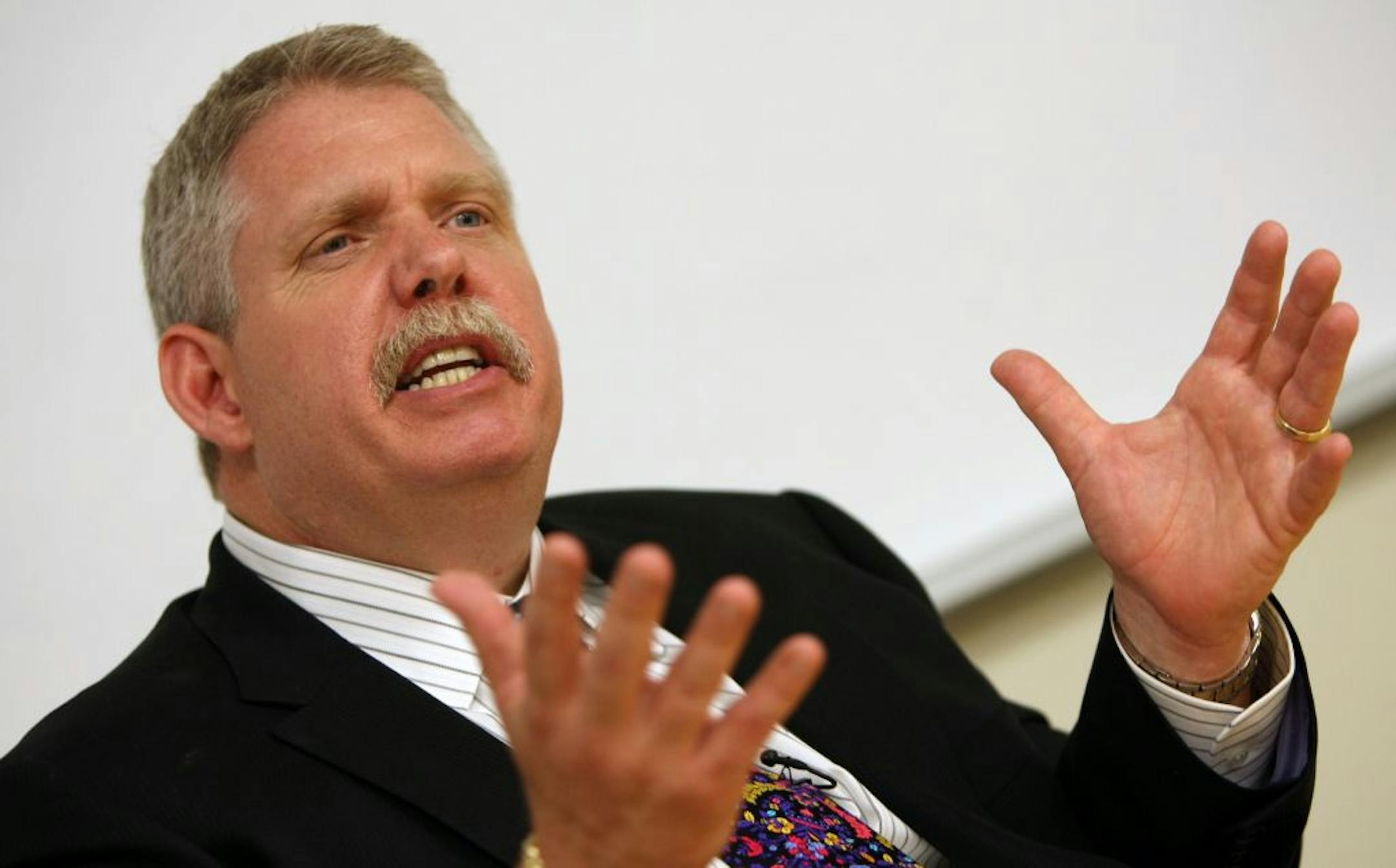 (right) New Best Buy CEO Brian Dunn answered media questions after the shareholder meeting.