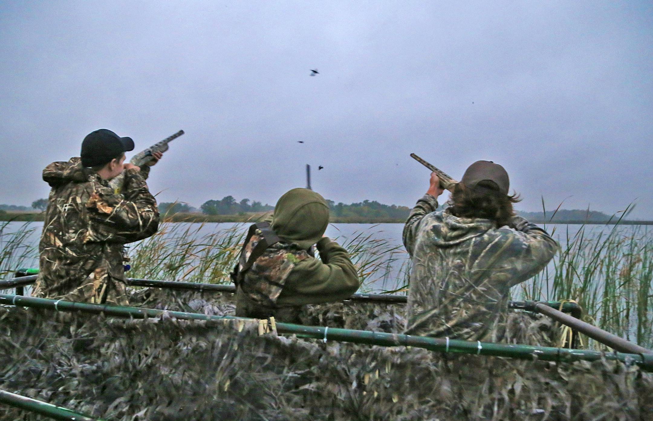 Trevor Unruh, left, Riley Mcalpine and Ryder Beckman drew down on a few blue-winged teal Saturday morning, opener of the 2016 Minnesota duck season. The three were hunting Pelican Lake near St. Michael.