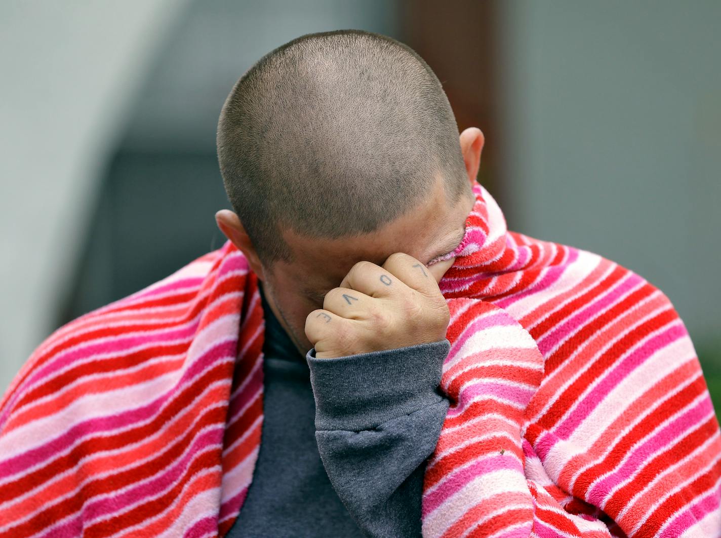 Jeremy Bush, brother of Jeff Bush, breaks down as he speaks to the media about attempting to rescue Jeff as he disappeared in a sinkhole Friday, March 1, 2013, in Seffner, Fla. Jeff Bush screamed for help and disappeared as a large sinkhole opened under the bedroom of the house, his brother said Friday.