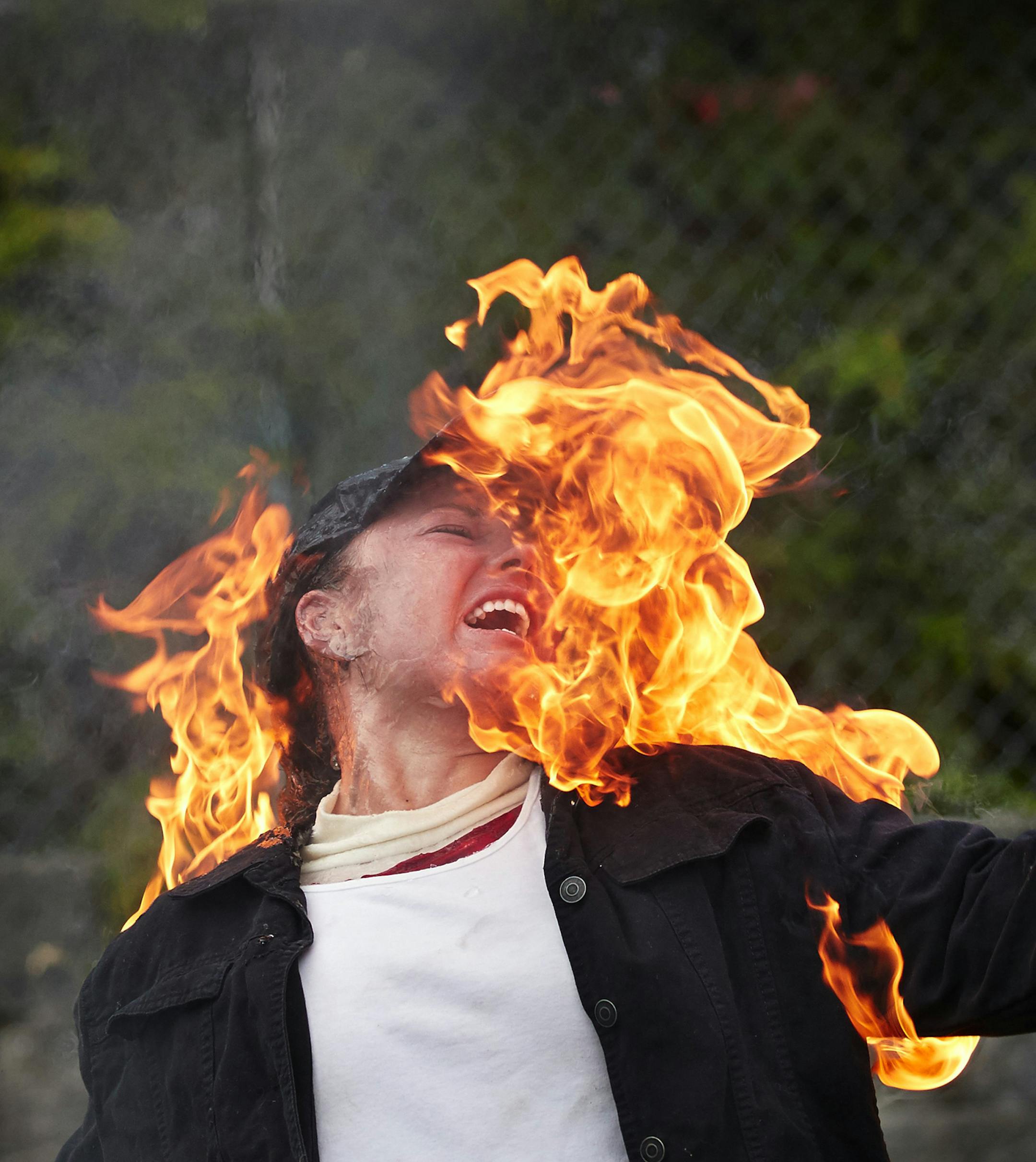 Student Ariel Lee is lighted for a fire burn at the International Stunt School in Seattle. (Benjamin Benschneider/The Seattle Times/TNS) ORG XMIT: 1192302