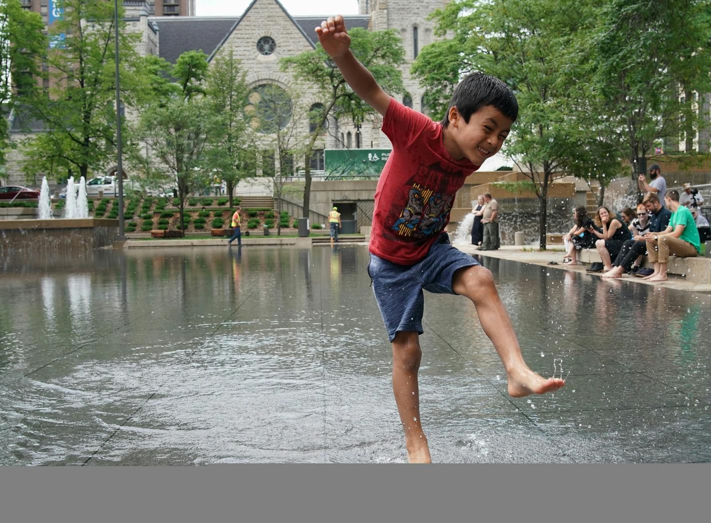 After renovations, Peavey Plaza in downtown Minneapolis was given a grand re-opening, which included running the water fountains and filling the reflecting pool which have been dry for years. Here, 6-year old Tenzin Thutop from Minneapolis played in the reflecting pool. ] Shari L. Gross &#x2022; shari.gross@startribune.com After renovations, Peavey Plaza in downtown Minneapolis was given a grand re-opening, which included running the water fountains and filling the reflecting pool which have bee