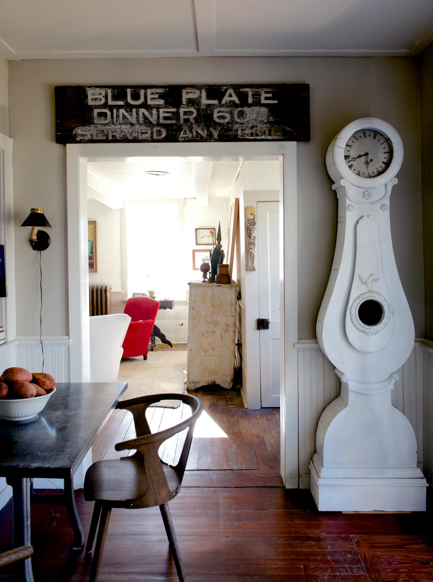 The 18th-century farmhouse home of Andrew Arrick and Michael Hofemann, with a sign over a door original to the inn that once stood here, in Tivoli, N.Y., Jan. 9, 2014. Selling their New York City loft a year ago and moving a hundred miles north to open an interior design store nearby, Arrick and Hofemann are in step with a major influx of urban expats remaking life in the Hudson River Valley. (Jane Beiles/The New York Times)