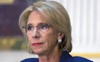 FILE &#xf3; Education Secretary Betsy DeVos attends a policy meeting in Washington, Aug. 16, 2018.DeVos is preparing new policies on campus sexual mis