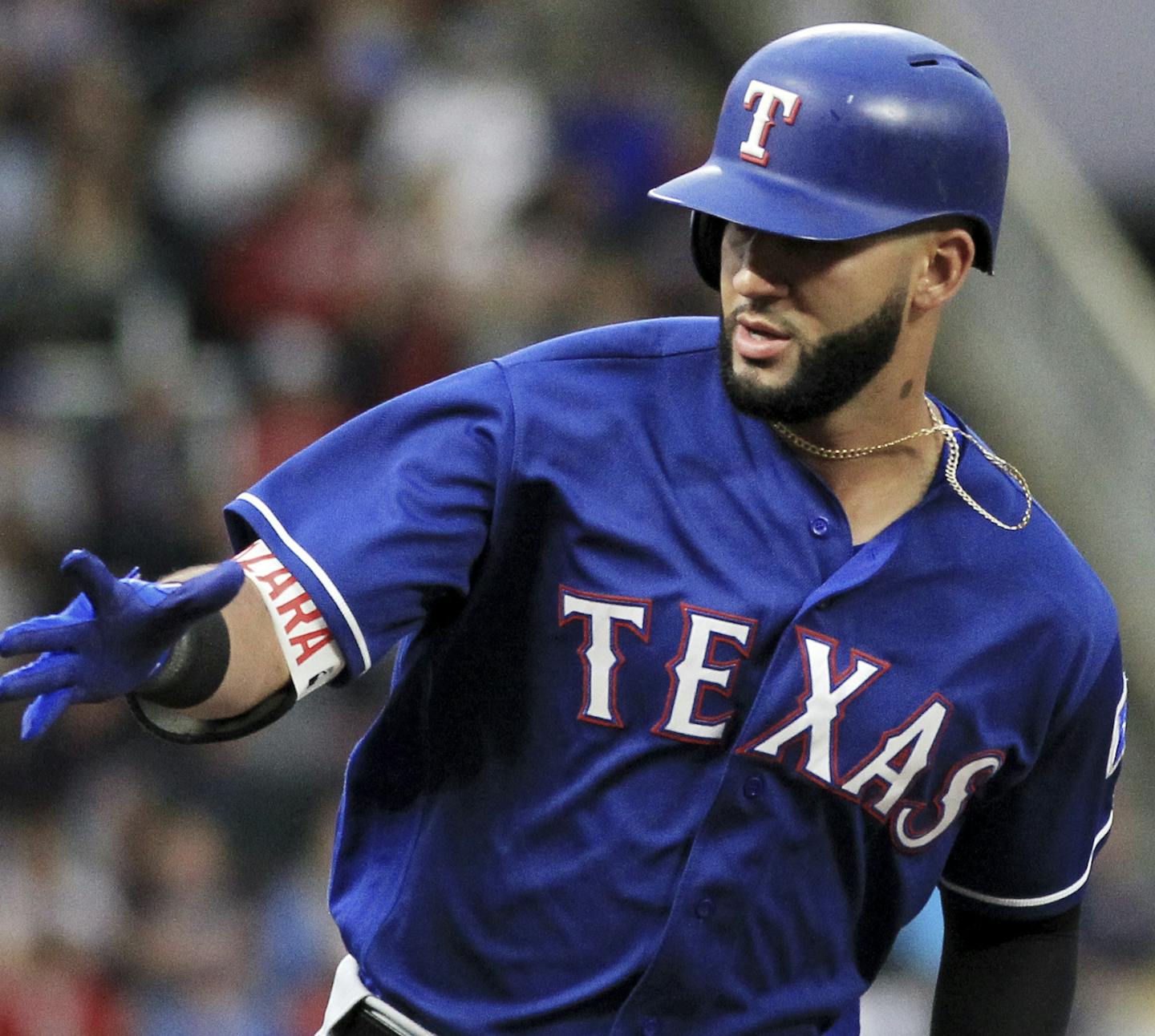 Texas Rangers' Nomar Mazara, right, is congratulated by third base coach Tony Beasley (27) after hitting a two-run home run against the Minnesota Twins in the first inning during a baseball game on Saturday, Aug. 5, 2017, in Minneapolis. (AP Photo/Andy Clayton-King)