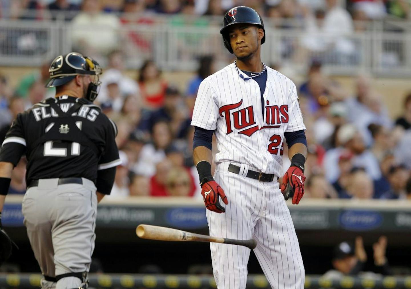 Twins shortstop Pedro Florimon reacts after striking out against Chicago White Sox starting pitcher Jake Peavy