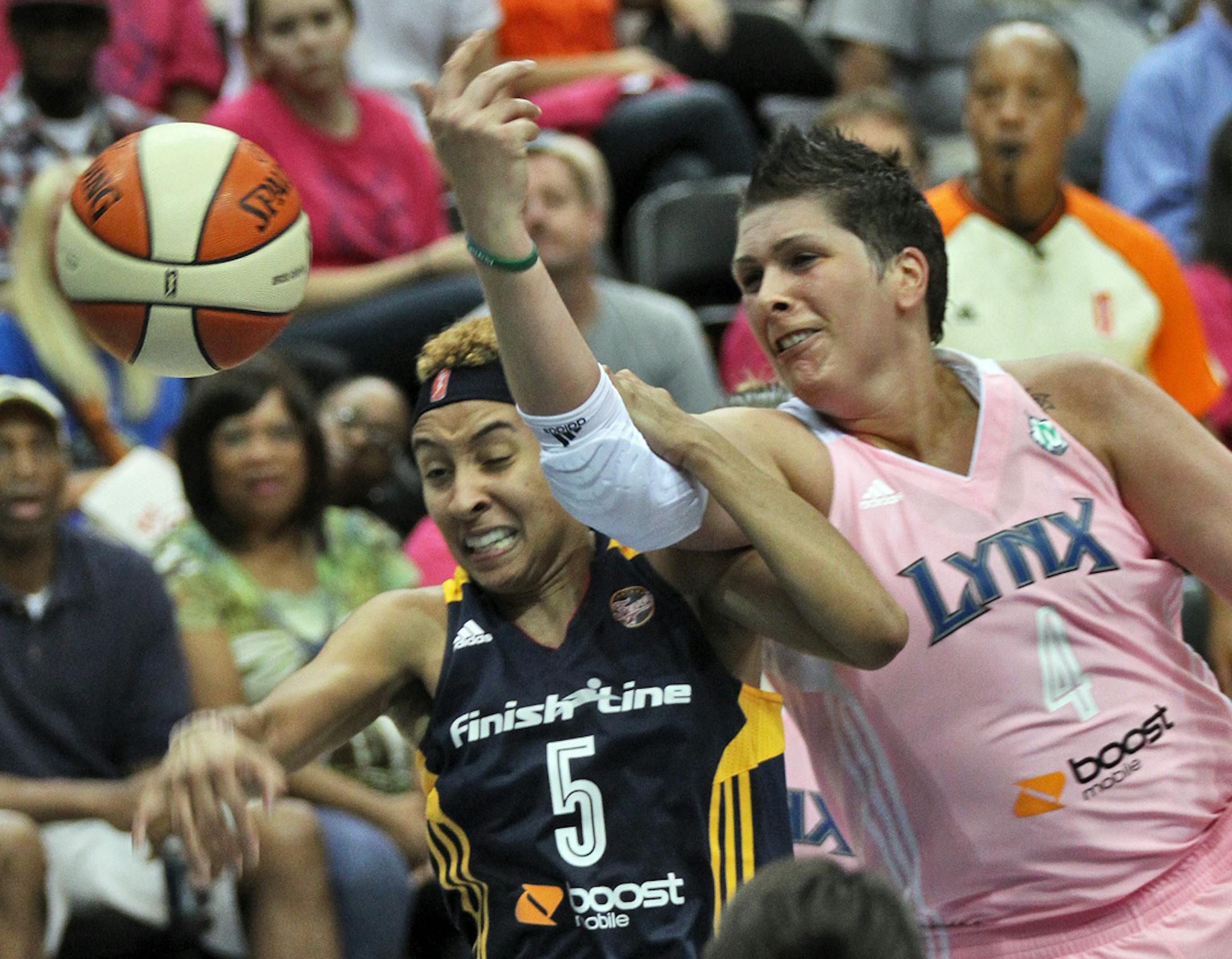 Indiana's Layshia Clarendon (5) and Minnesota's Lynx Janel McCarville fought for control of a rebound.