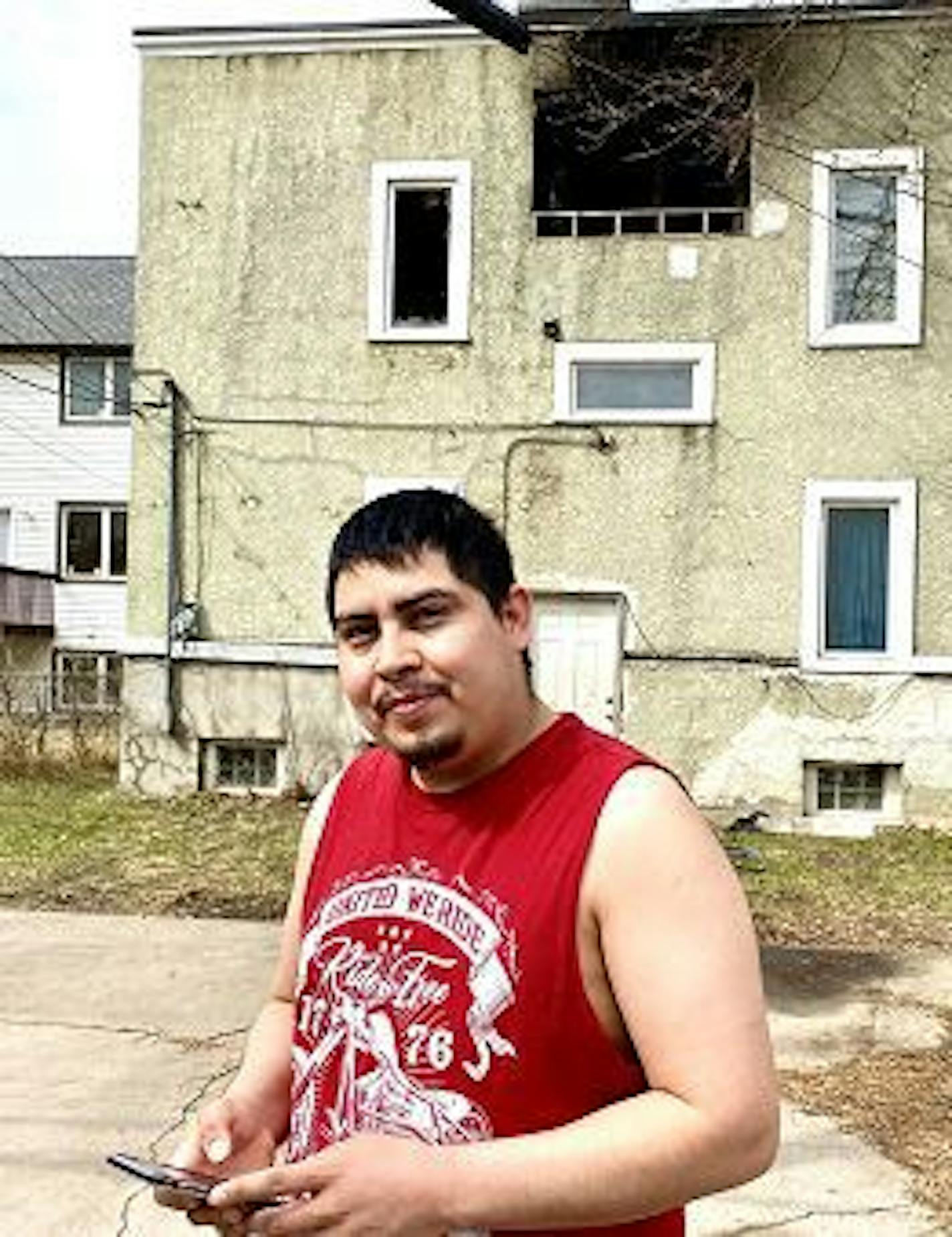 Rudy Mejia helped wake neighbors in the burning fourplex across the alley.