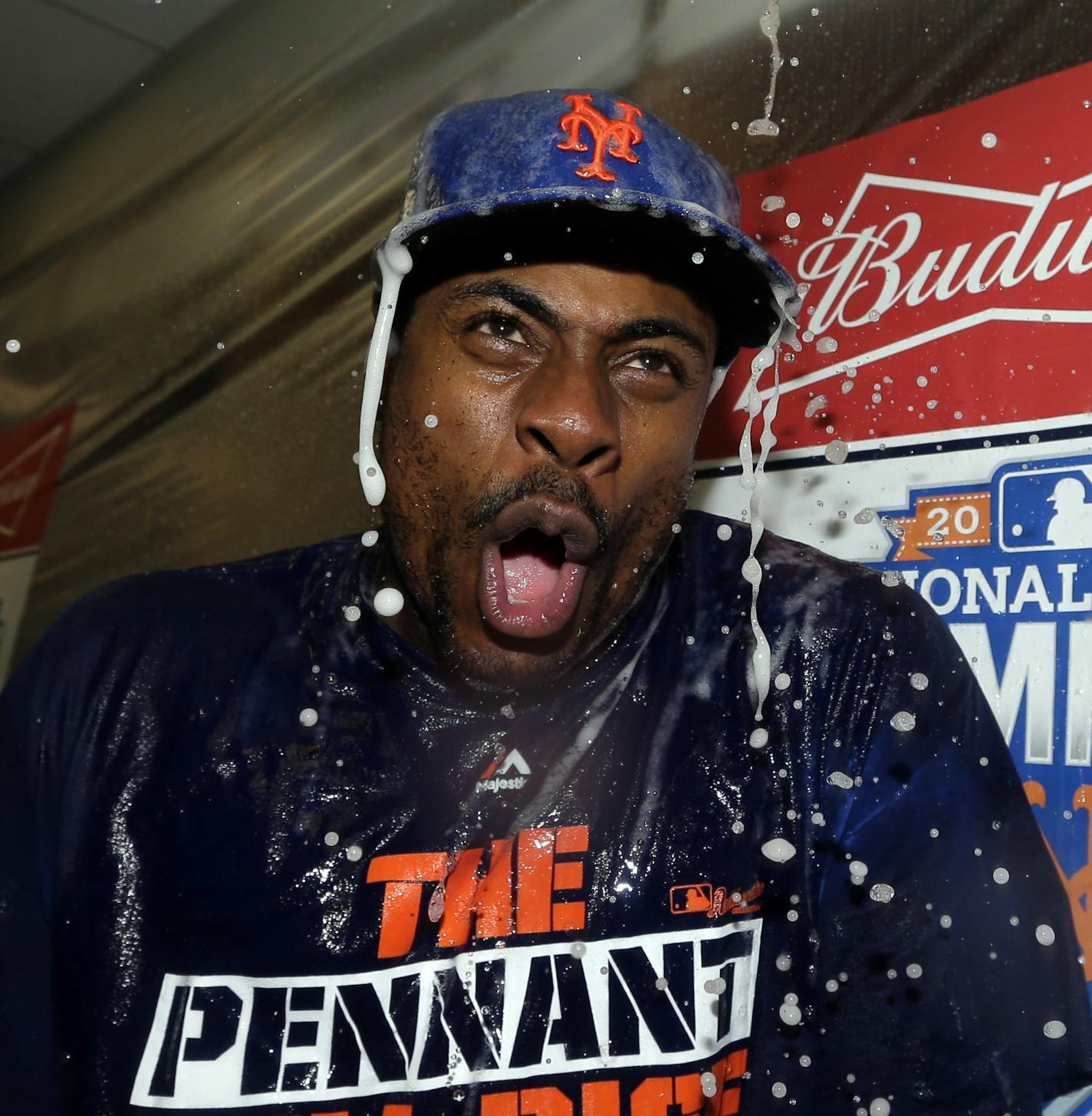 New York Mets' Curtis Granderson celebrates after Game 4 of the National League baseball championship series against the Chicago Cubs Wednesday, Oct. 21, 2015, in Chicago. The Mets won 8-3 to advance to the World Series. (AP Photo/David J. Phillip)