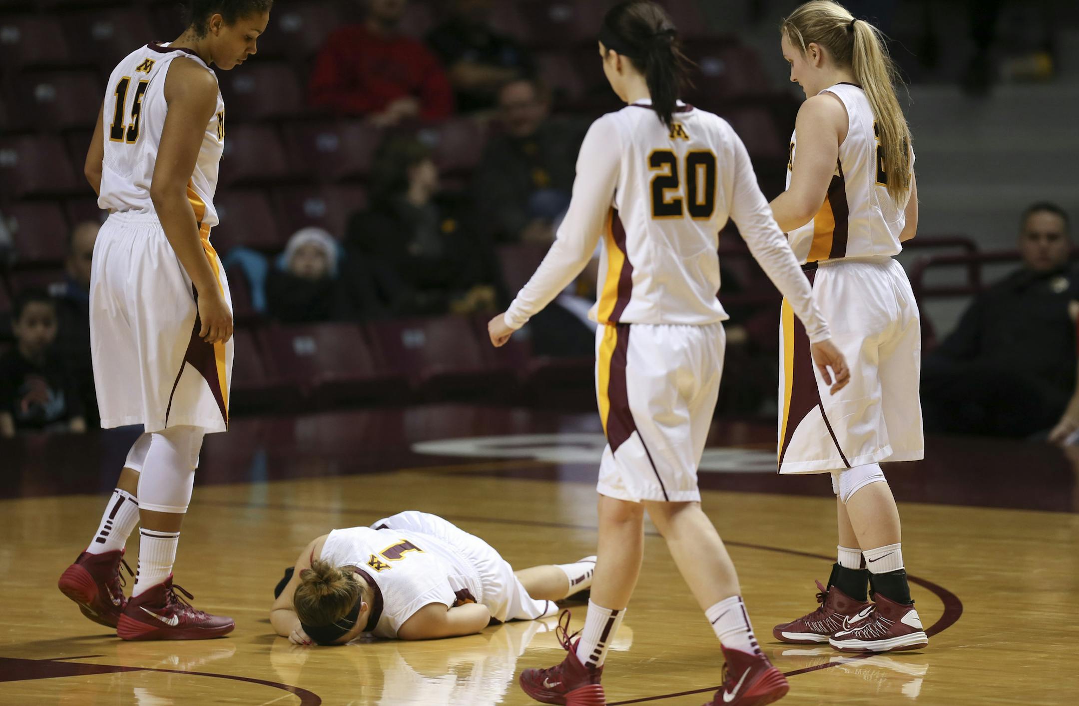 Gophers star guard Rachel Banham went down awkwardly after getting tangled with an SMU player while diving for a loose ball.