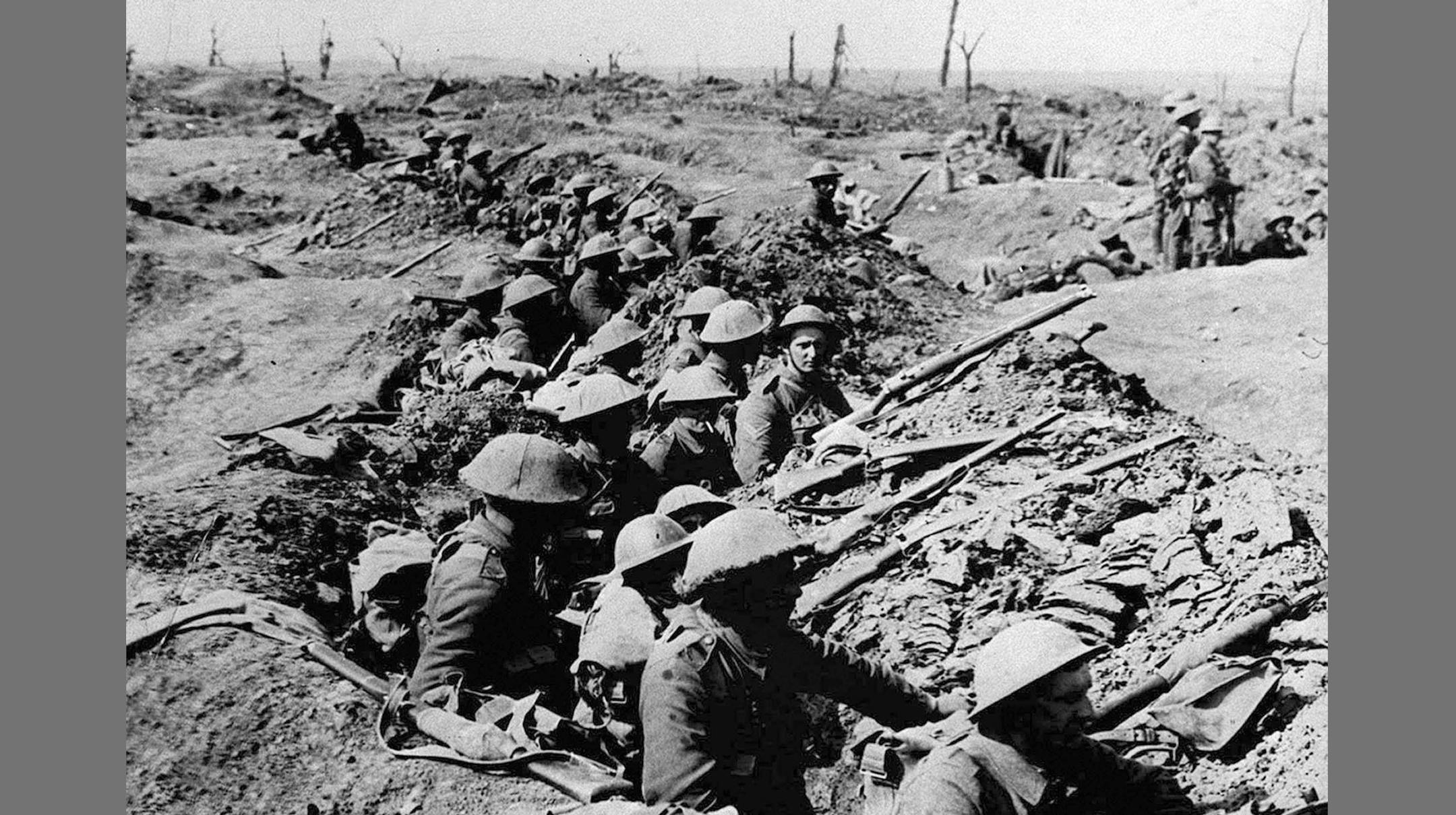 This photo dated July 1, 1916, shows British infantrymen occupying a shallow trench in a ruined landscape before an advance during the Battle of the Somme.