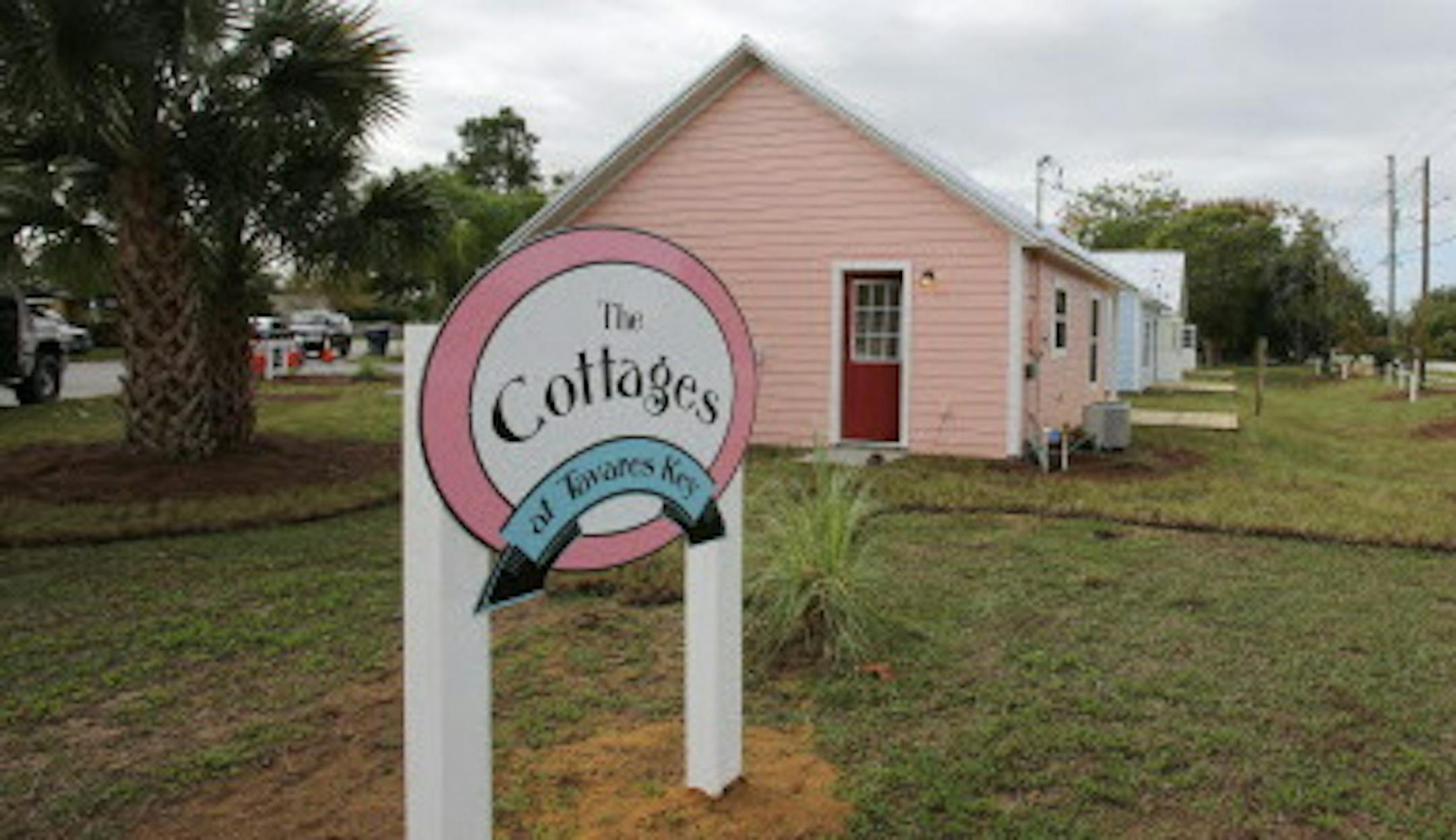 Lake County builder Jack Smith, left, has built three tiny houses on one lot — “wee houses” — as rentals for young professionals.