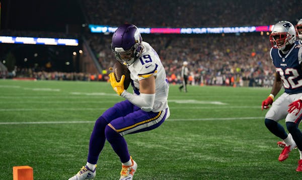 Vikings wide receiver Adam Thielenan has an NFL-leading 98 receptions this season, including this touchdown grab last week vs. New England.